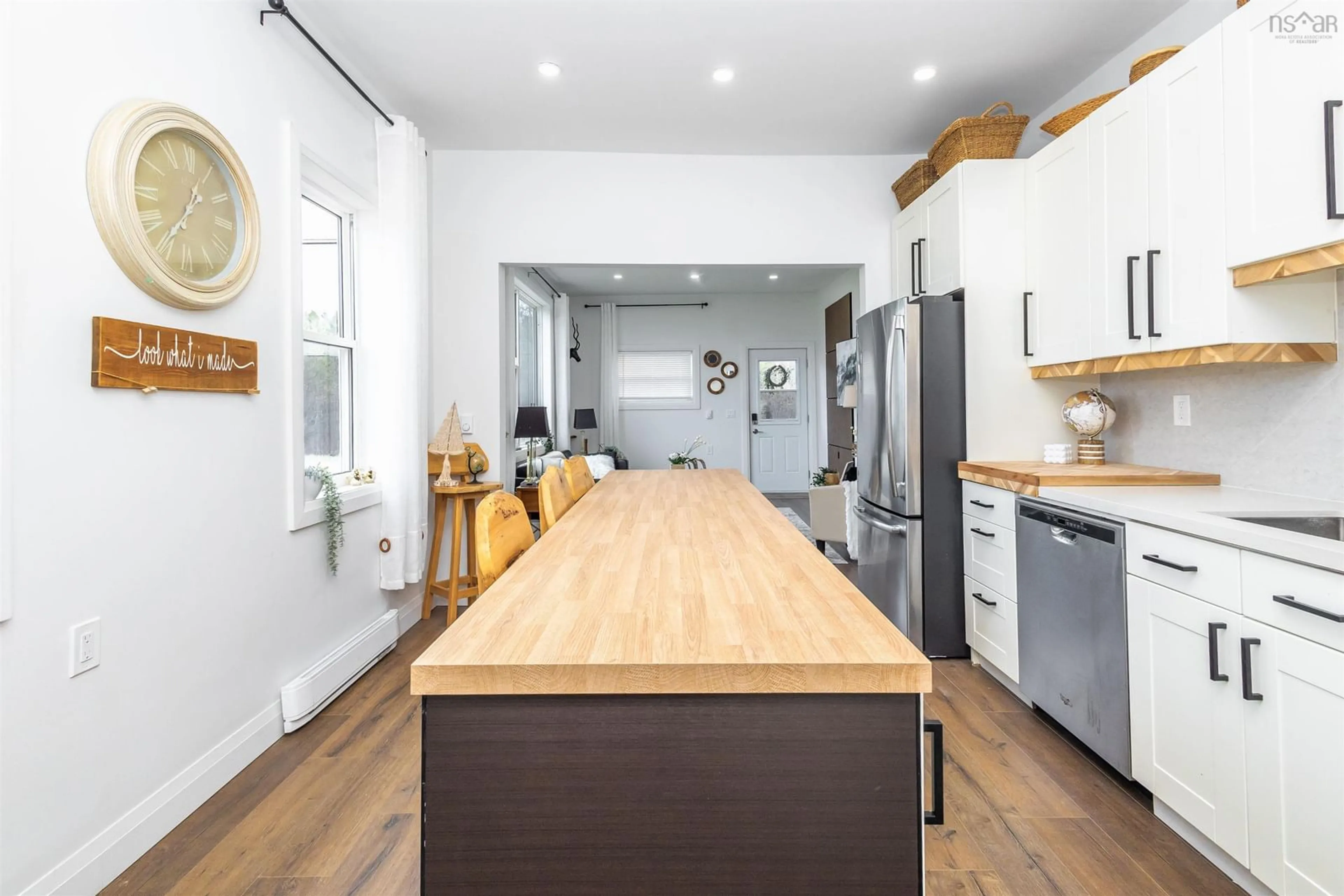 Open concept kitchen, wood/laminate floor for 3749 New Waterford Hwy, New Victoria Nova Scotia B1H 5B8