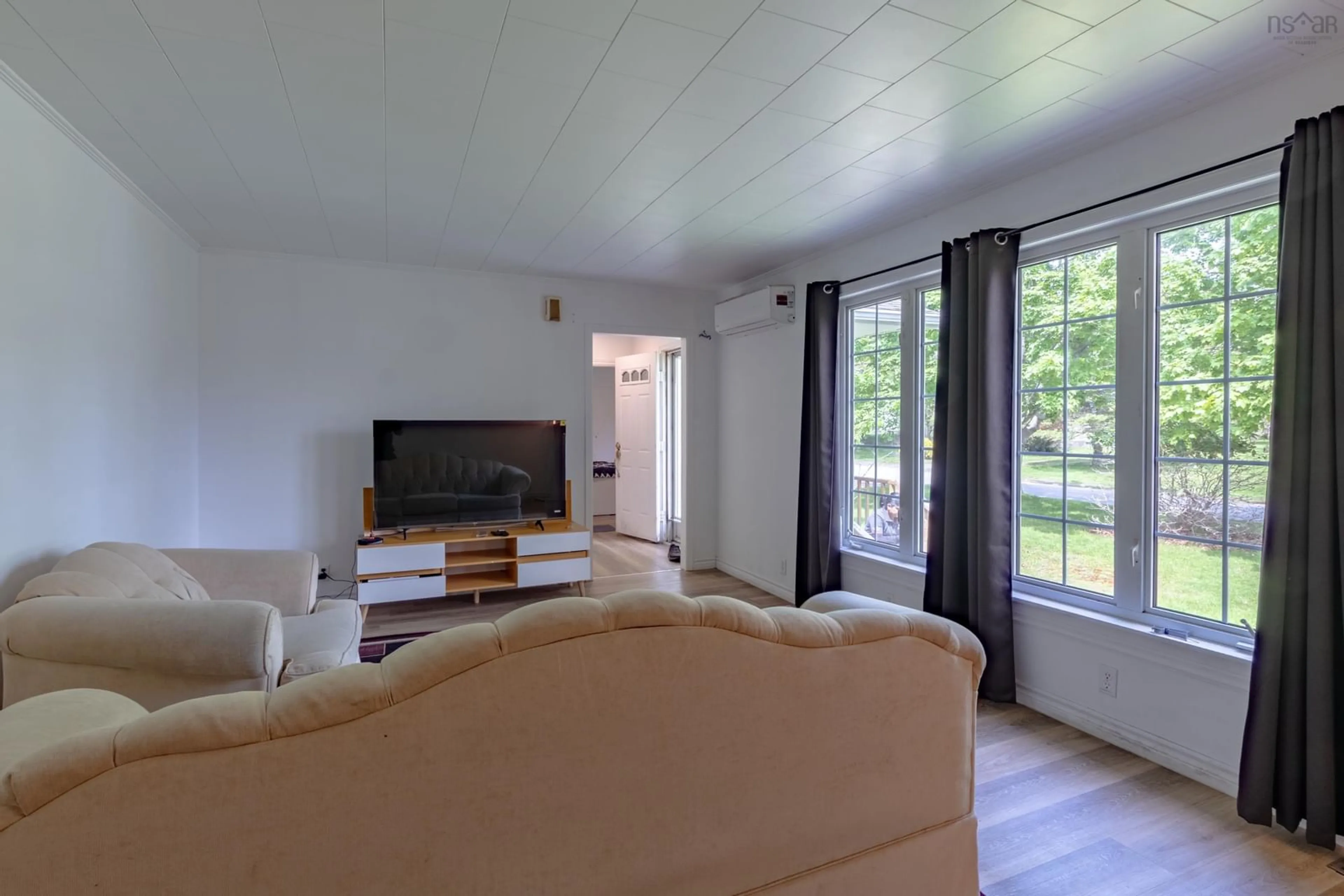 Living room with furniture, wood/laminate floor for 119 Harriet St, Shelburne Nova Scotia B0T 1W0