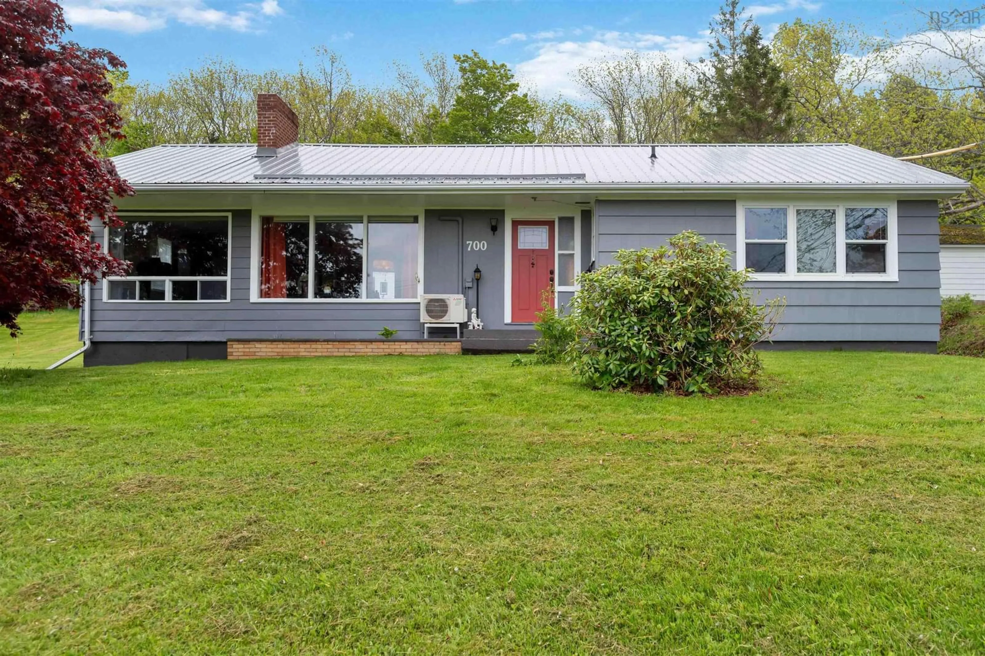 Home with vinyl exterior material, street for 700 Highway 1, Deep Brook Nova Scotia B0S 1J0
