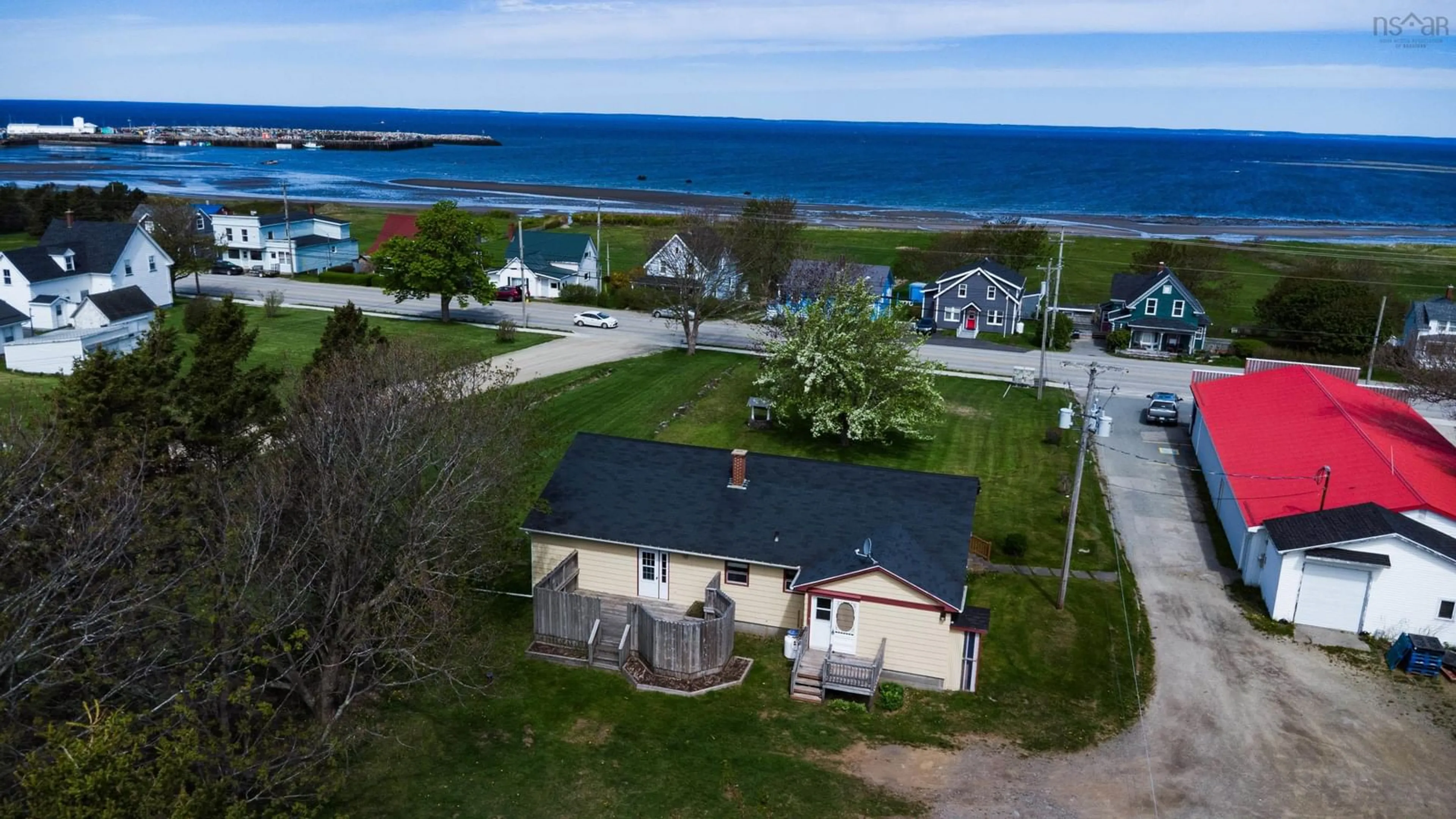 A pic from outside/outdoor area/front of a property/back of a property/a pic from drone, water/lake/river/ocean view for 8370 Highway 1, Meteghan Nova Scotia B0W 2J0