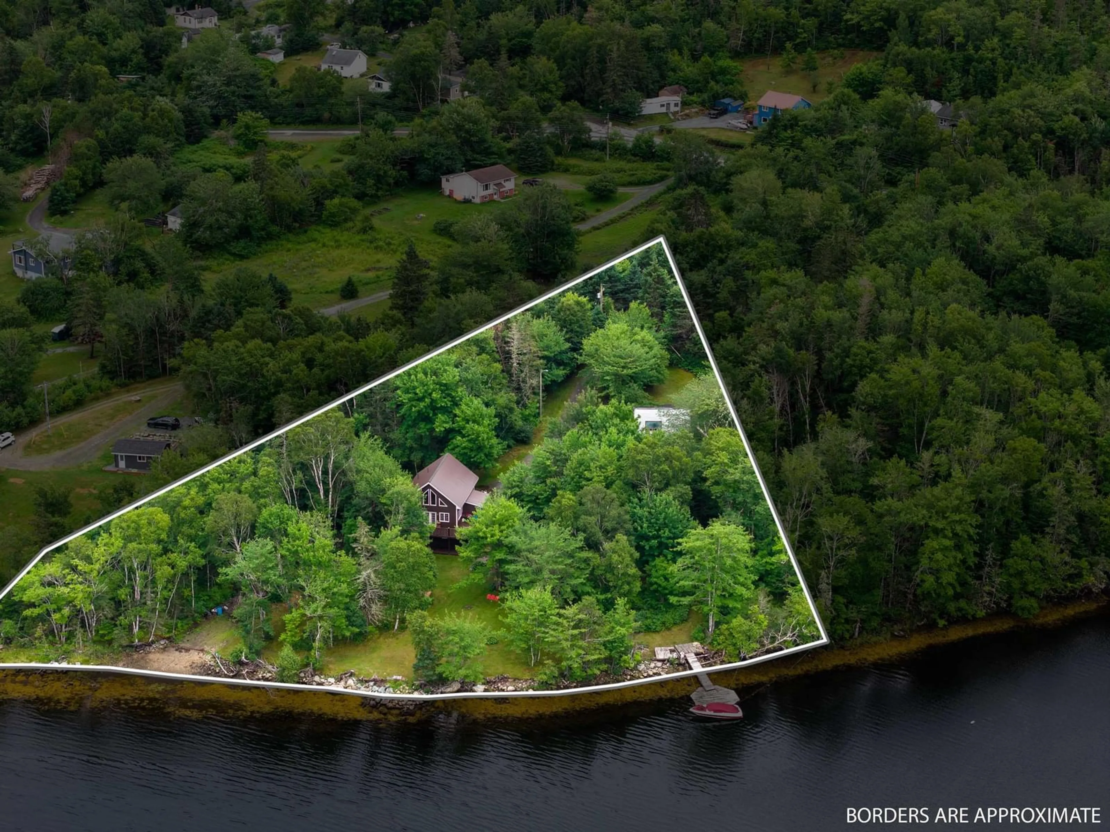 A pic from outside/outdoor area/front of a property/back of a property/a pic from drone, water/lake/river/ocean view for 59 West Side Rd, Sheet Harbour Nova Scotia B0J 3B0