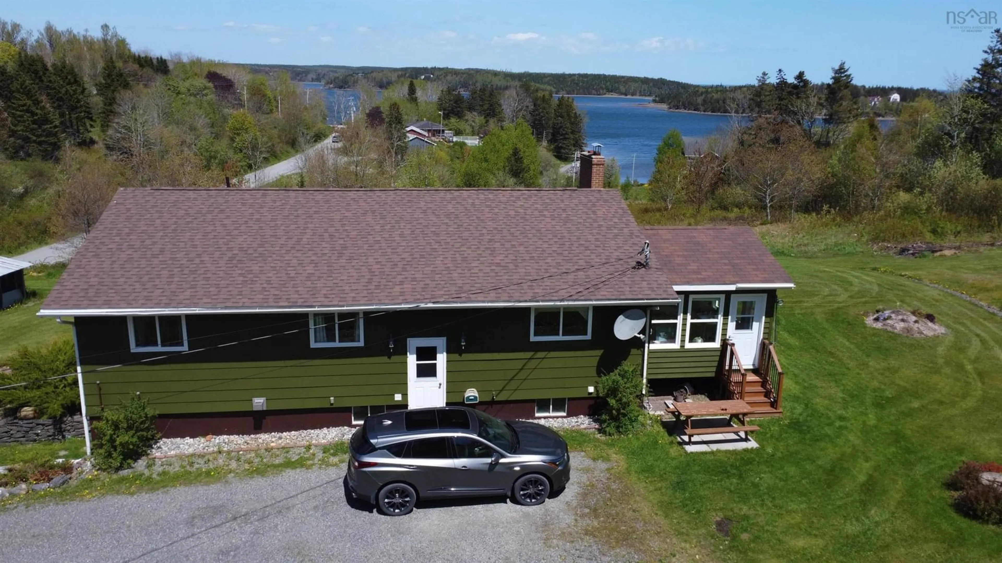 A pic from outside/outdoor area/front of a property/back of a property/a pic from drone, water/lake/river/ocean view for 104 Green Street, Guysborough Nova Scotia B0H 1N0