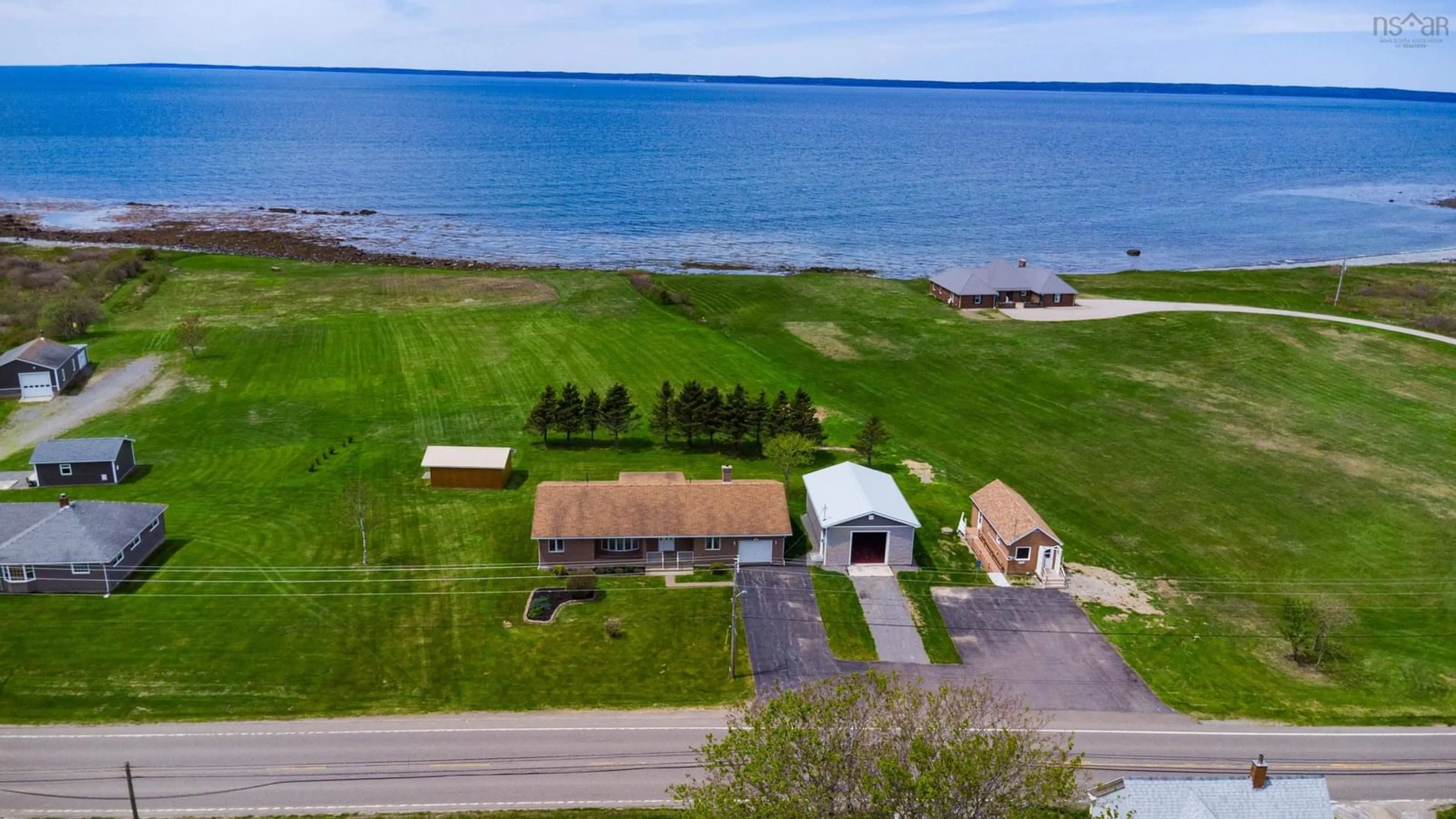 A pic from outside/outdoor area/front of a property/back of a property/a pic from drone, water/lake/river/ocean view for 1285 Highway 1, Little Brook Nova Scotia B0W 1M0