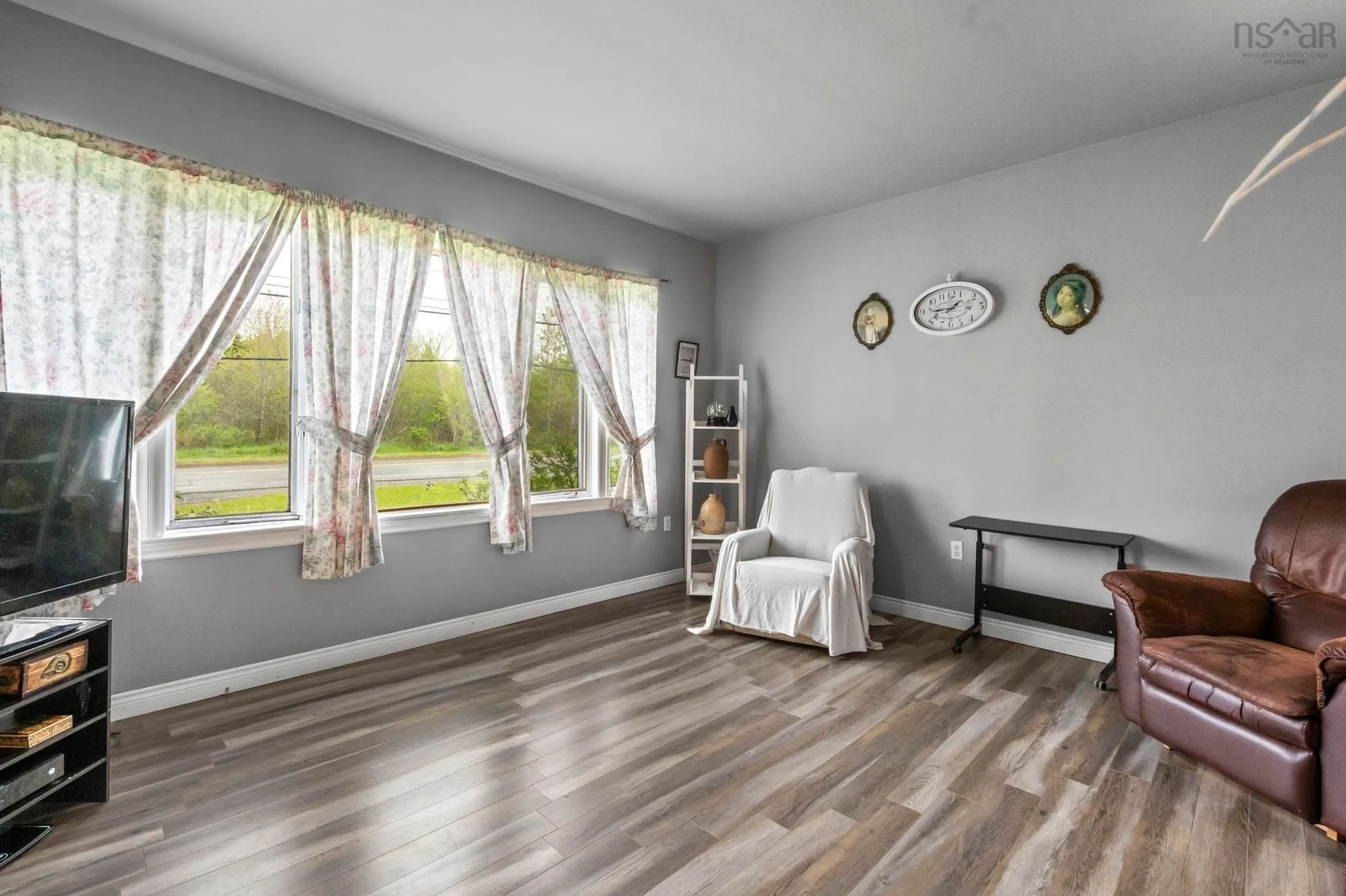Living room with furniture, wood/laminate floor for 1335 Highway 2, Lantz Nova Scotia B2S 1Z2