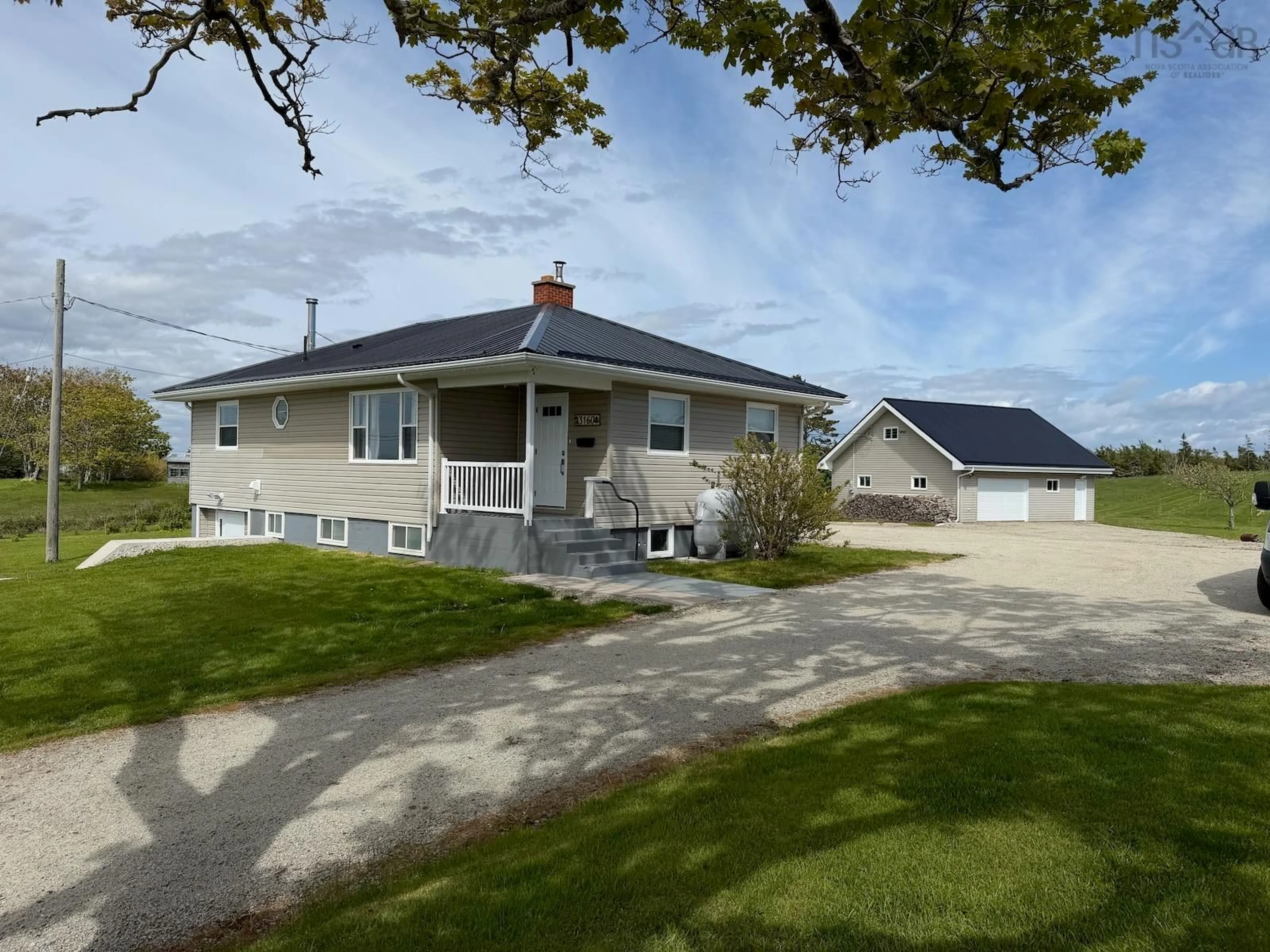 A pic from outside/outdoor area/front of a property/back of a property/a pic from drone, street for 3160 Main Shore Rd, Port Maitland Nova Scotia B5A 5V5