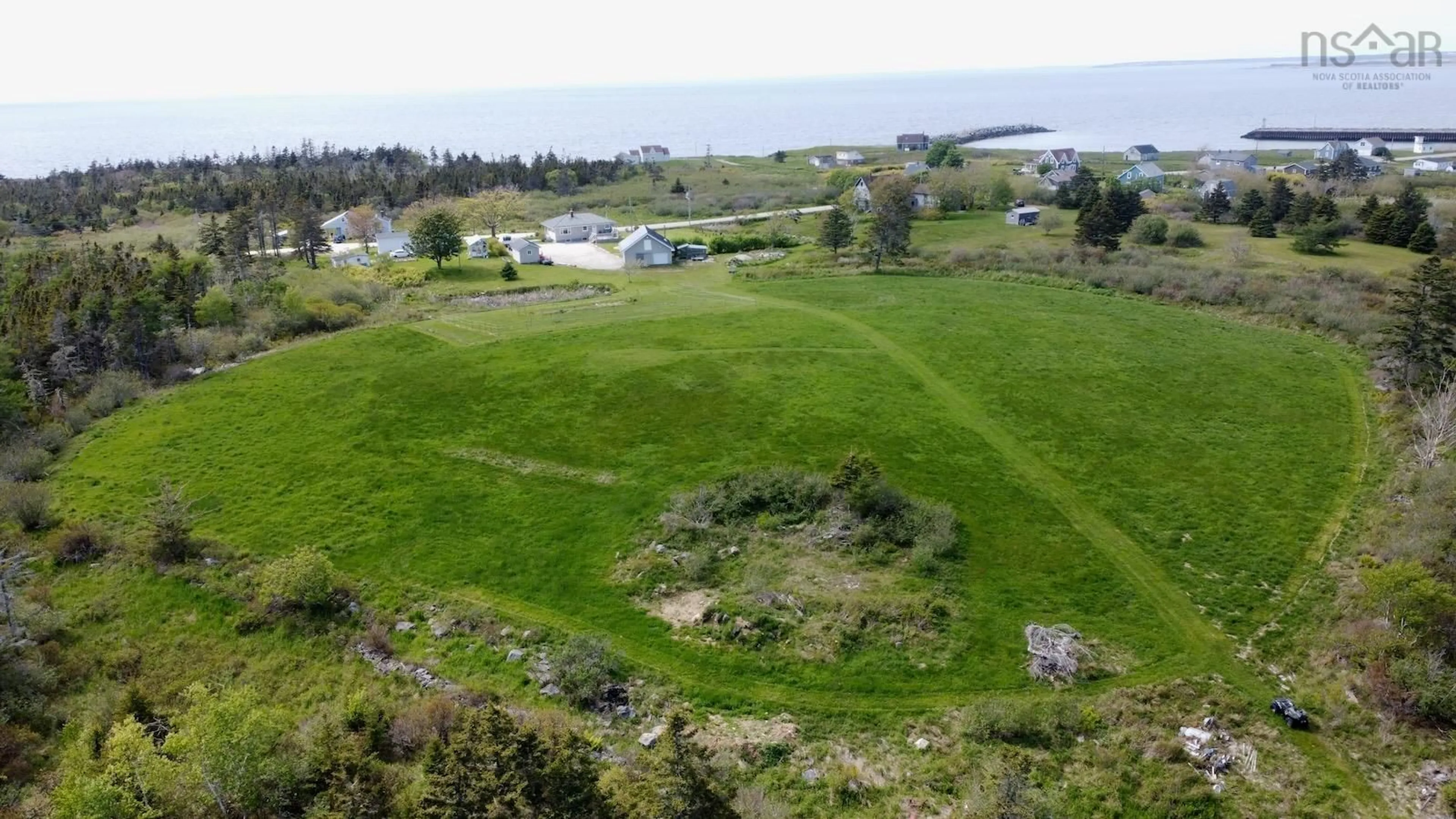 A pic from outside/outdoor area/front of a property/back of a property/a pic from drone, water/lake/river/ocean view for 3160 Main Shore Rd, Port Maitland Nova Scotia B5A 5V5