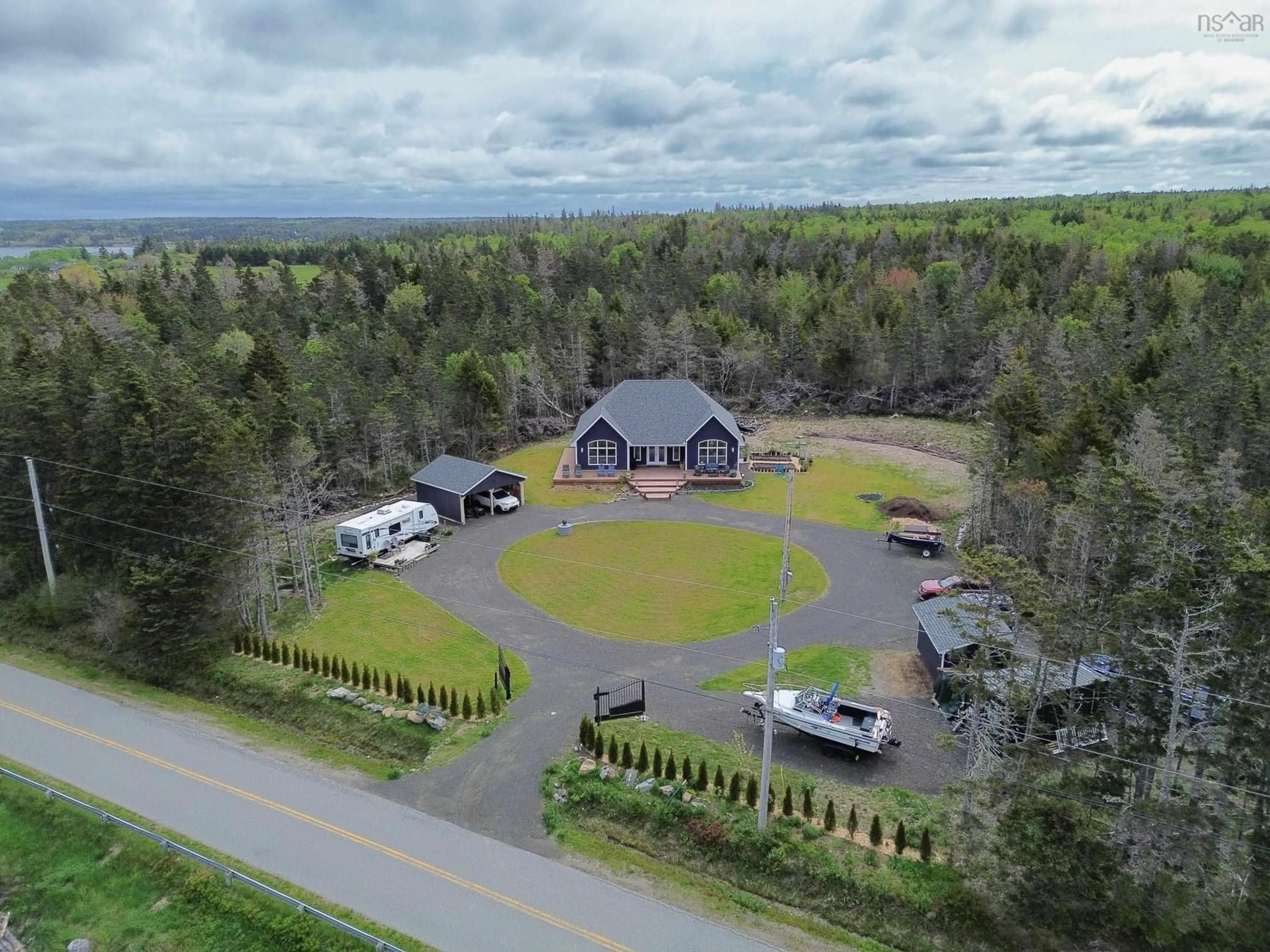 A pic from outside/outdoor area/front of a property/back of a property/a pic from drone, mountain view for 684 Riverside Rd, New Edinburgh Nova Scotia B0W 3T0