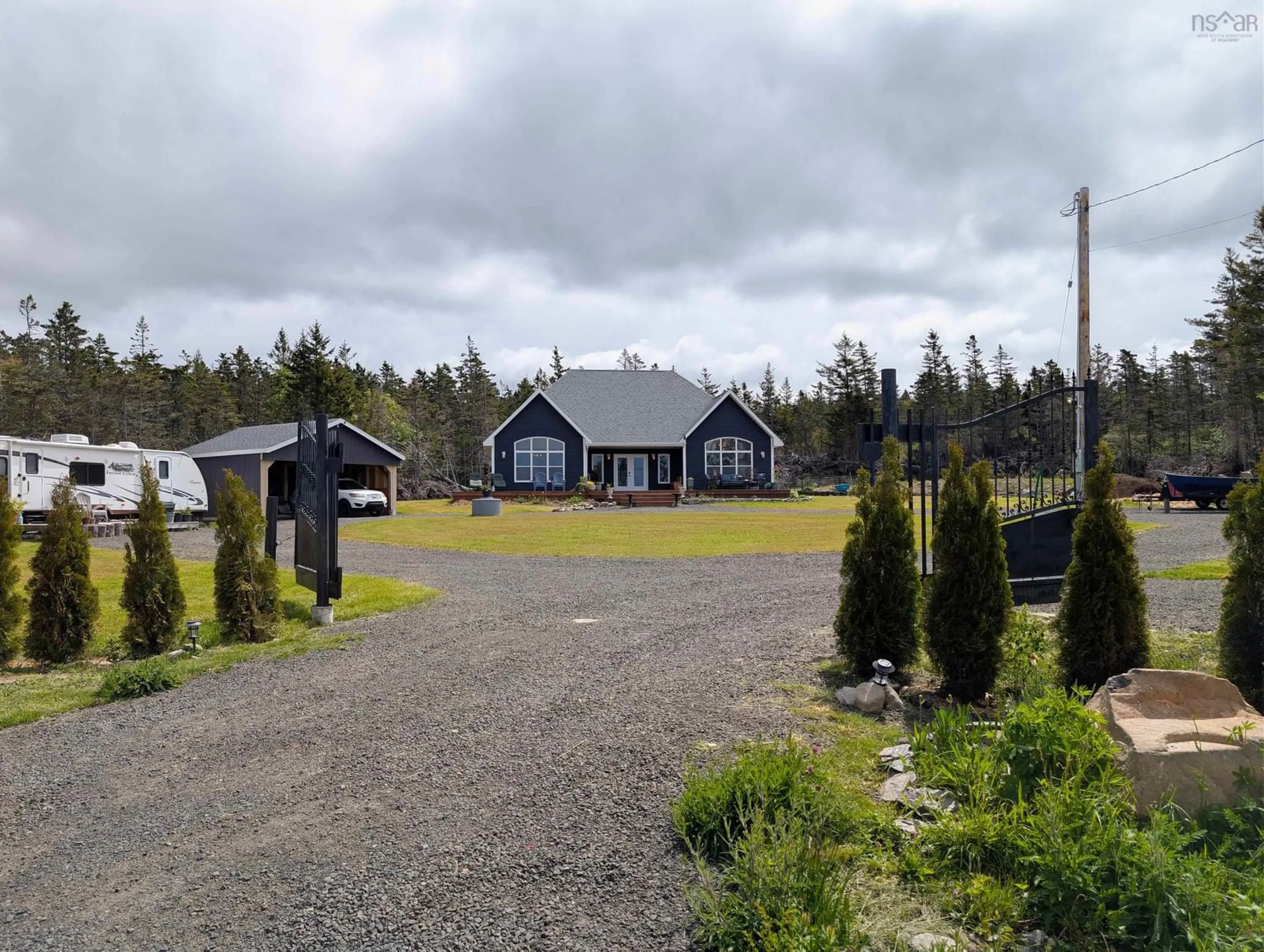 A pic from outside/outdoor area/front of a property/back of a property/a pic from drone, unknown for 684 Riverside Rd, New Edinburgh Nova Scotia B0W 3T0