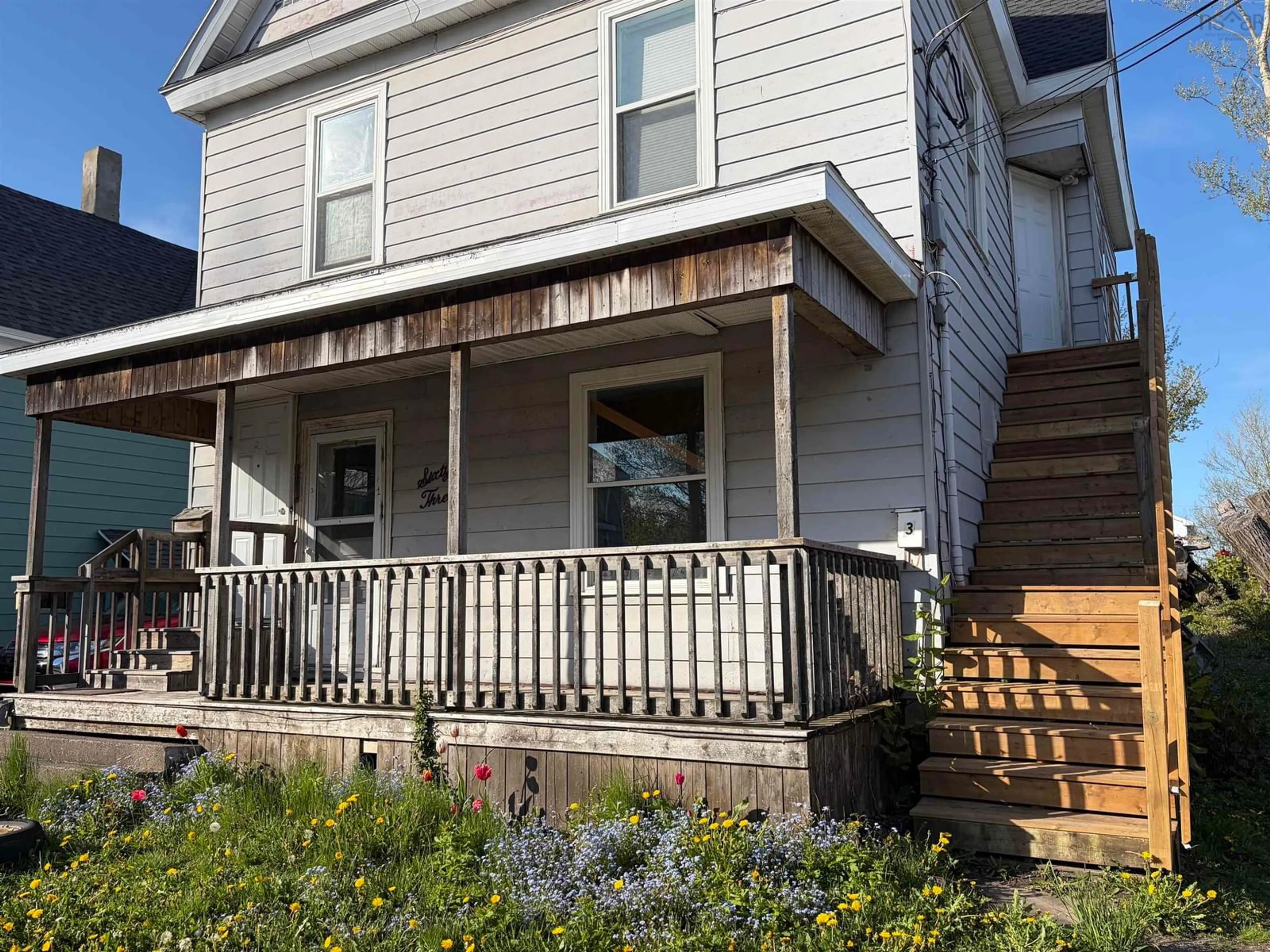 Home with vinyl exterior material, street for 63 Dolbin St, Sydney Nova Scotia B1P 1S4