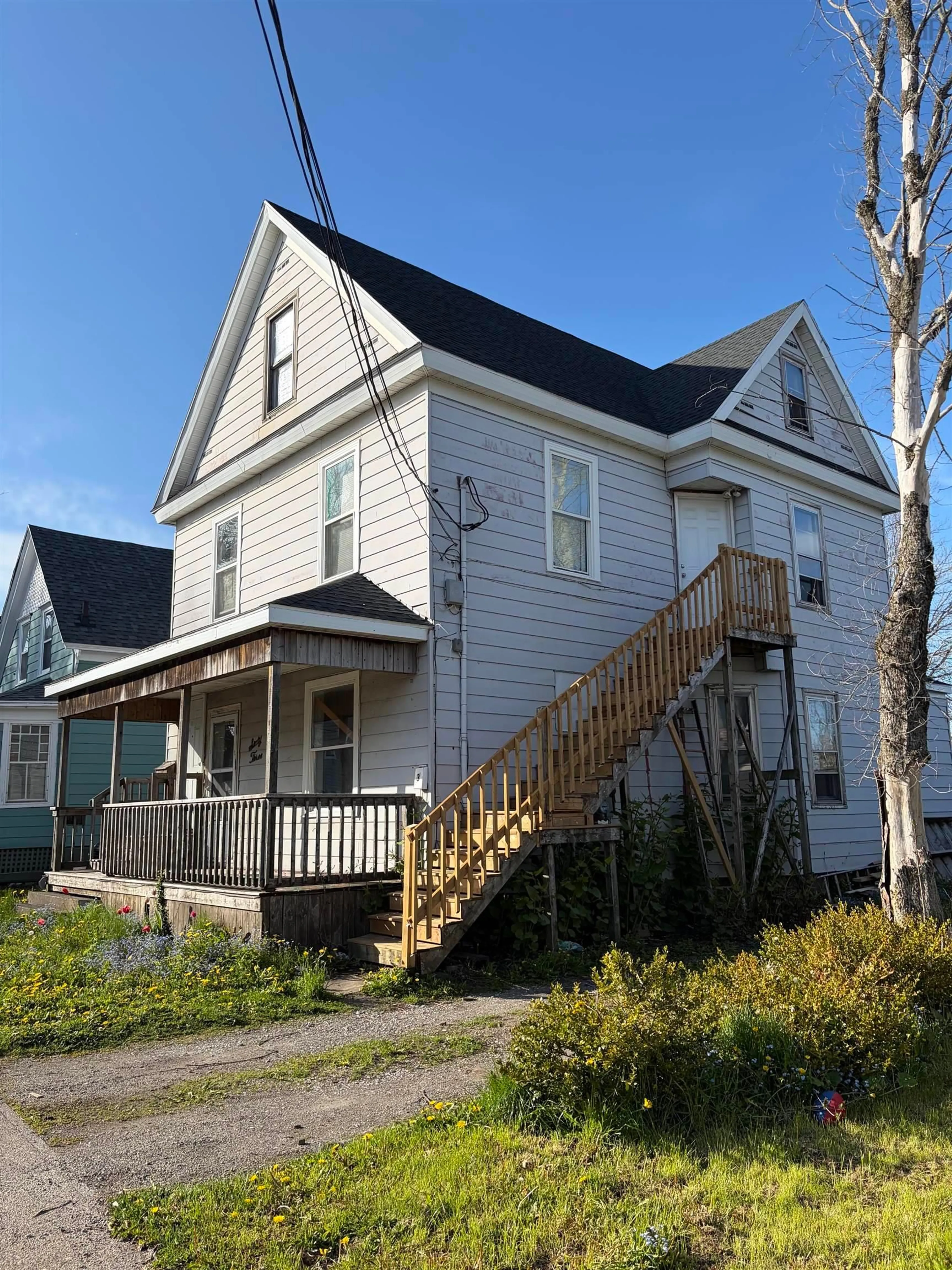 Home with vinyl exterior material, street for 63 Dolbin St, Sydney Nova Scotia B1P 1S4