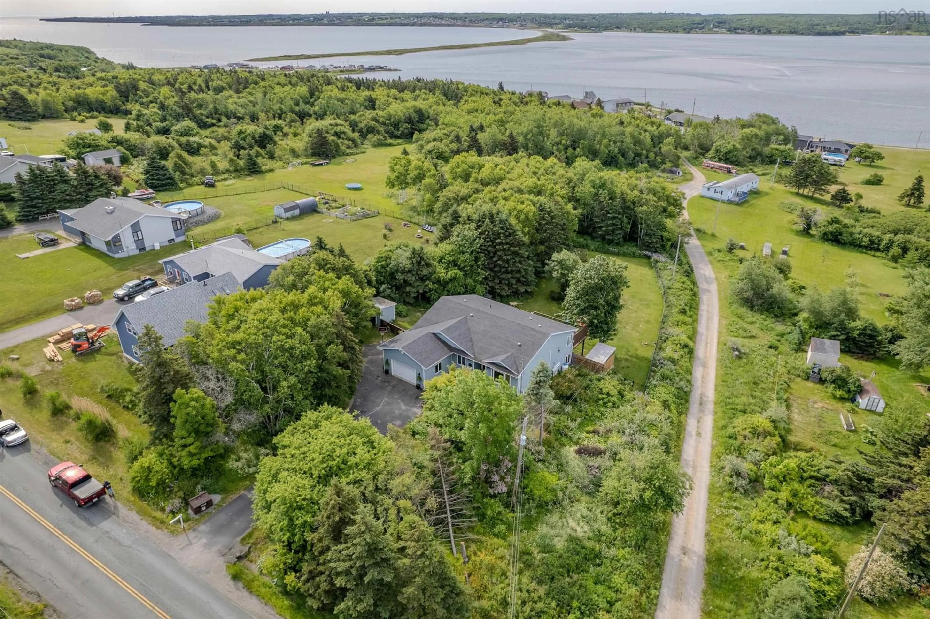 A pic from outside/outdoor area/front of a property/back of a property/a pic from drone, water/lake/river/ocean view for 2660 Lingan Rd, Sydney Nova Scotia B1H 4K2