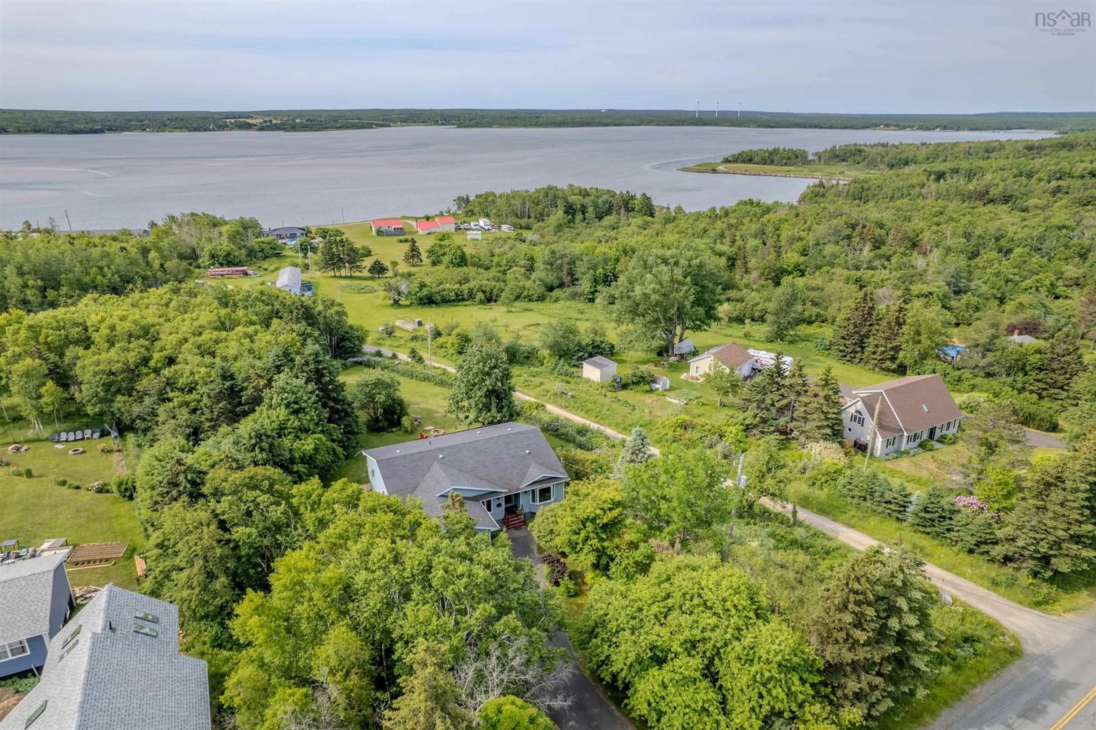 A pic from outside/outdoor area/front of a property/back of a property/a pic from drone, water/lake/river/ocean view for 2660 Lingan Rd, Sydney Nova Scotia B1H 4K2