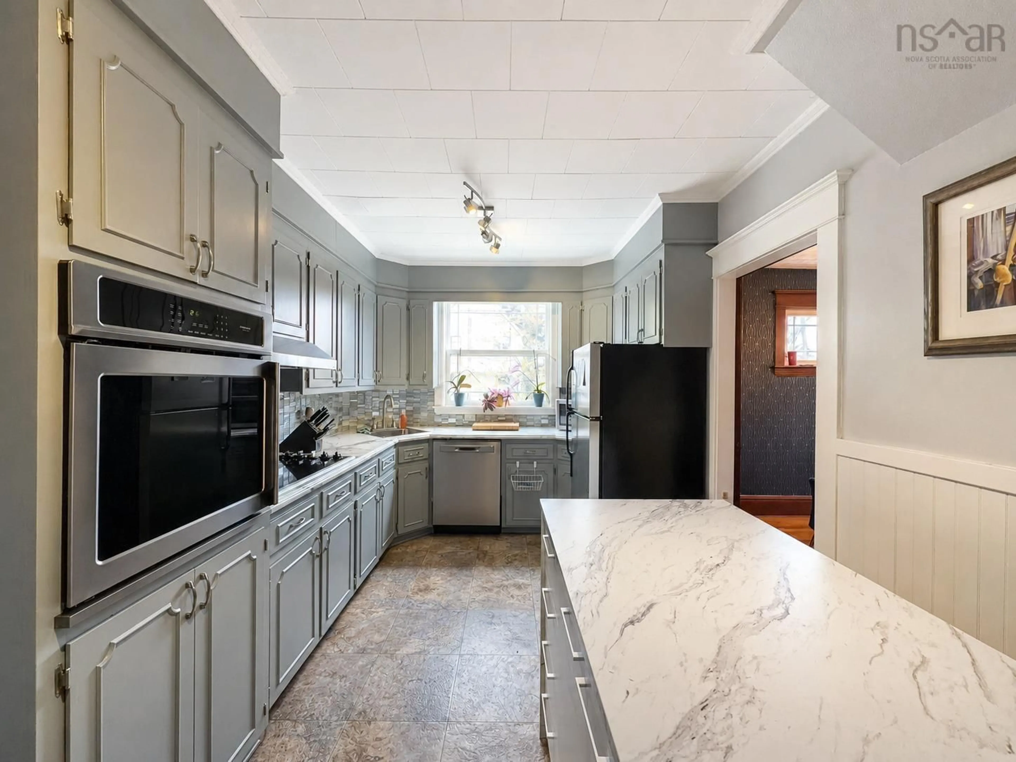 Open concept kitchen, ceramic/tile floor for 71 Hospital St, Sydney Nova Scotia B1P 2H9