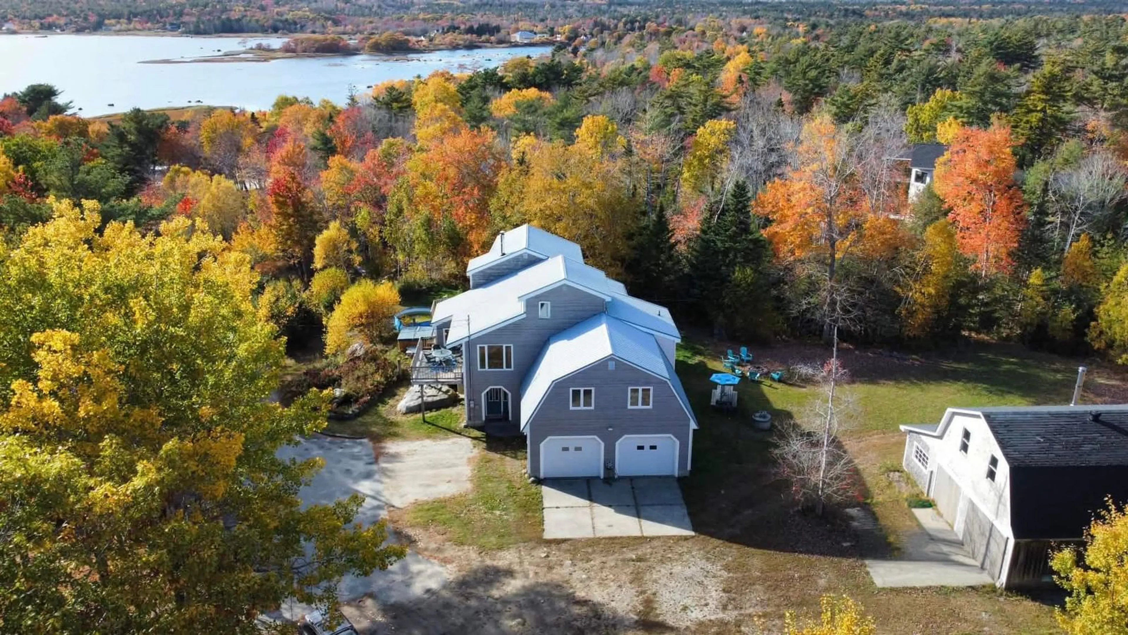 A pic from outside/outdoor area/front of a property/back of a property/a pic from drone, water/lake/river/ocean view for 187 Hartz Point Rd, Shelburne Nova Scotia B0T 1W0