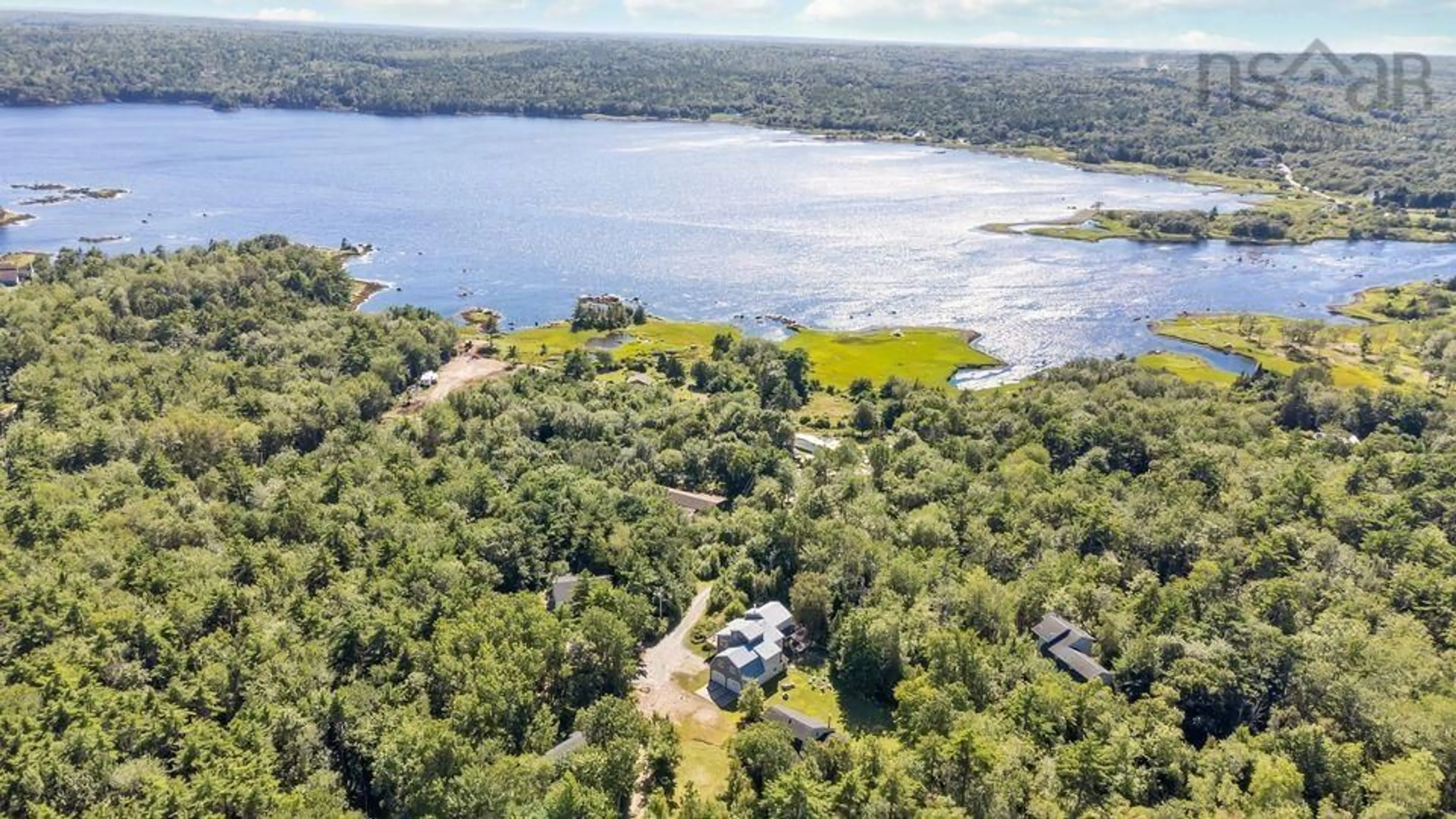 A pic from outside/outdoor area/front of a property/back of a property/a pic from drone, water/lake/river/ocean view for 187 Hartz Point Rd, Shelburne Nova Scotia B0T 1W0