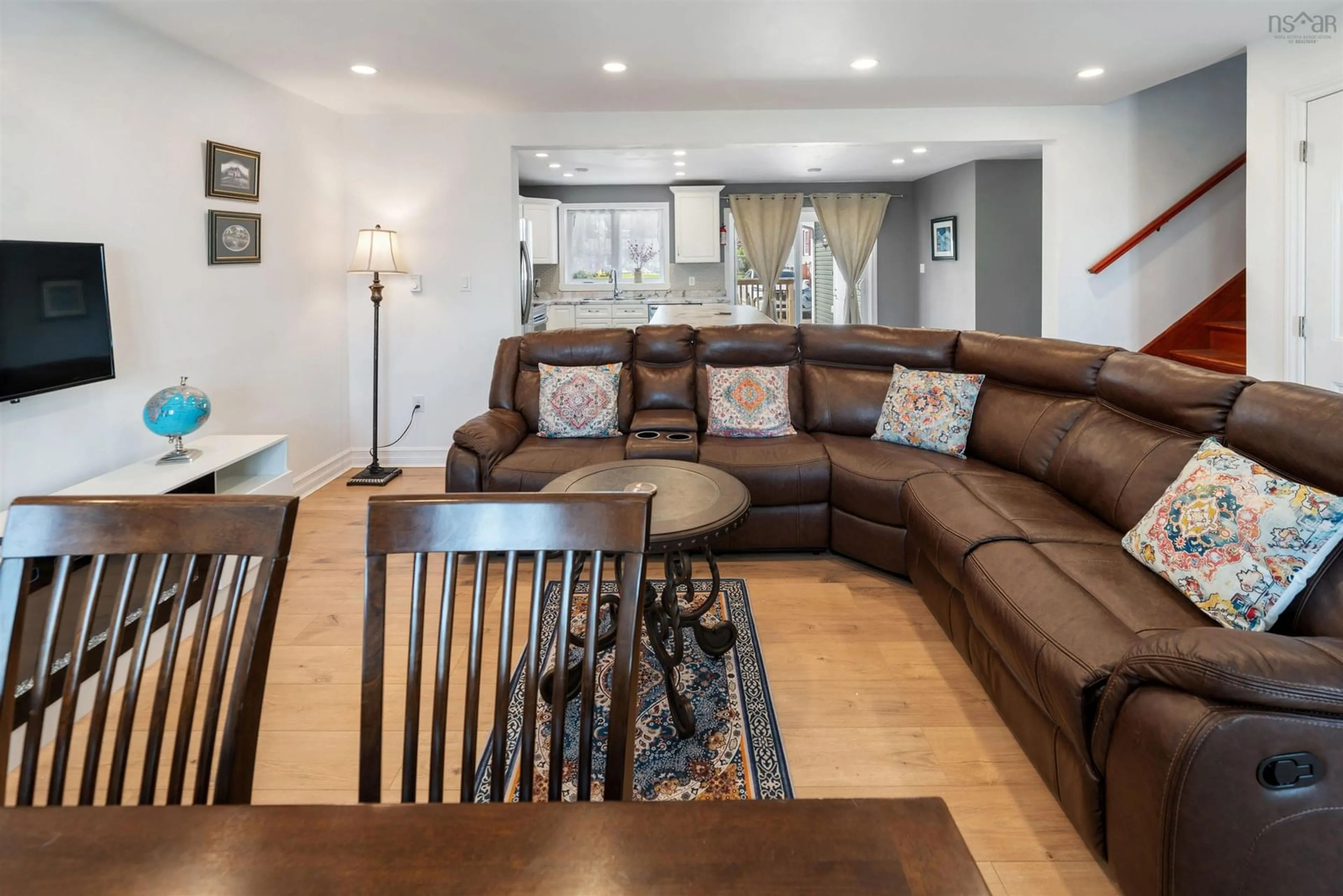 Living room with furniture, wood/laminate floor for 275 High St, Pictou Nova Scotia B0K 1H0