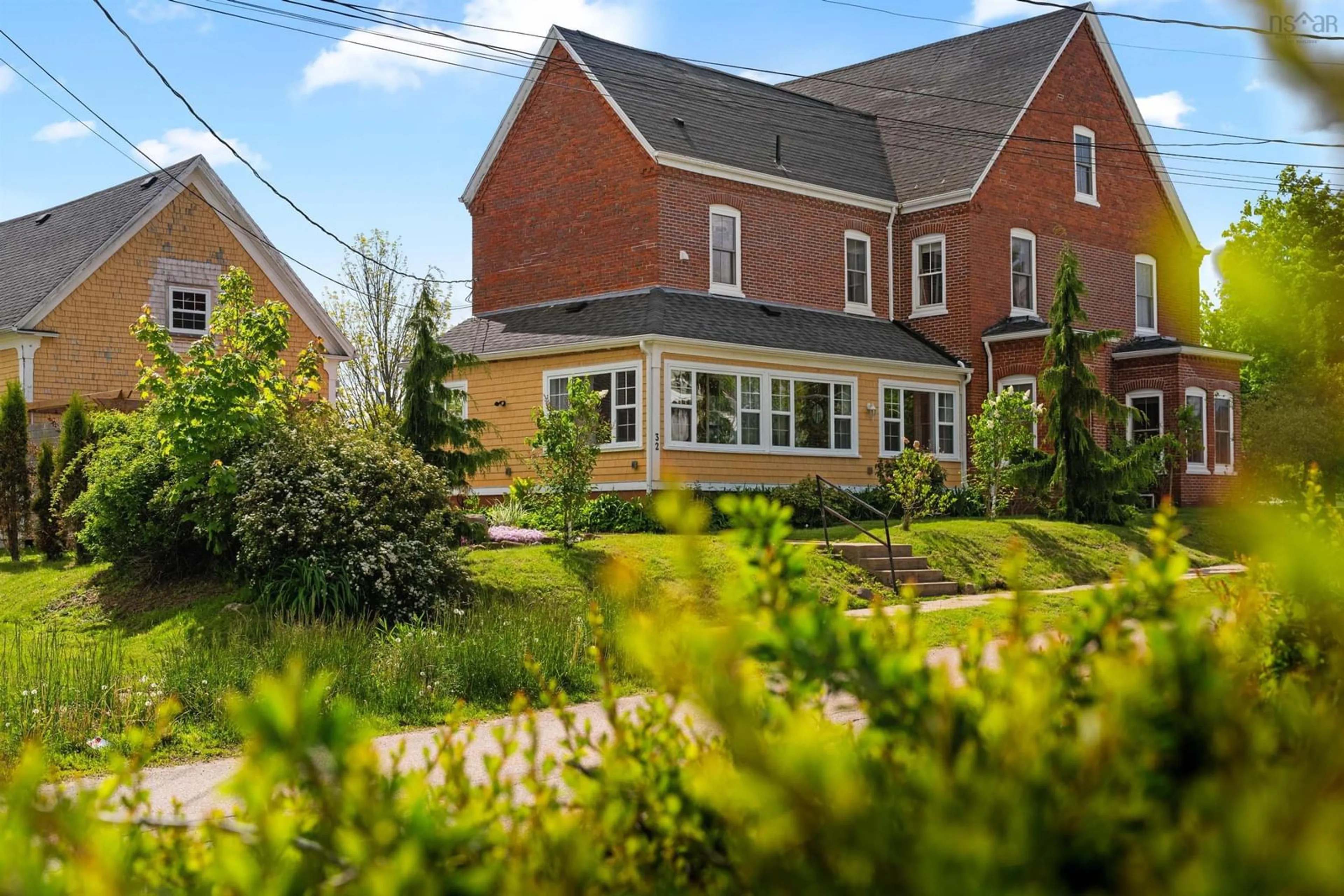 A pic from outside/outdoor area/front of a property/back of a property/a pic from drone, street for 32 Washington St, Bridgetown Nova Scotia B0S 1C0
