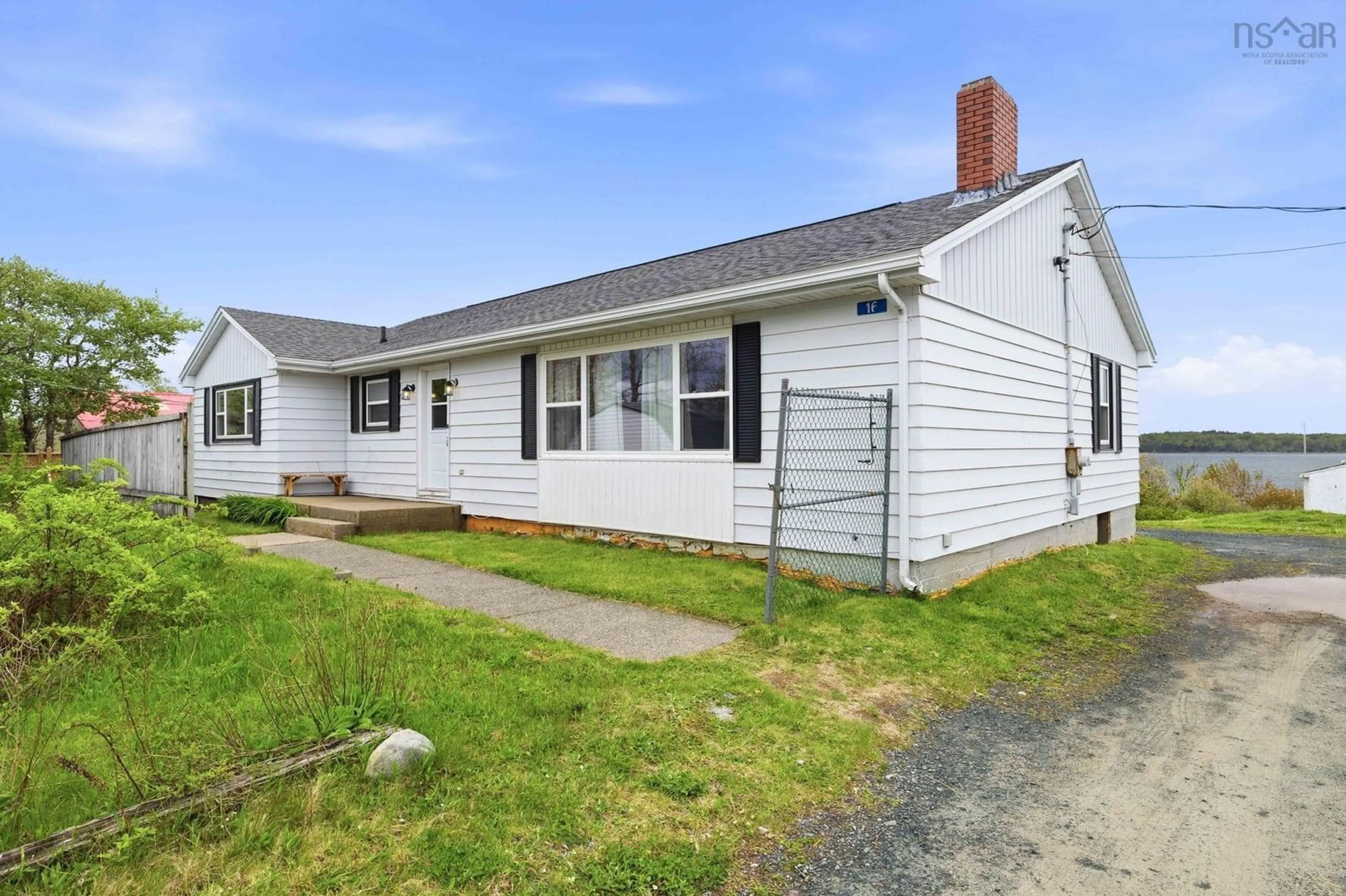 Home with vinyl exterior material, street for 16 Twin Lane, Eastern Passage Nova Scotia B3G 1M5