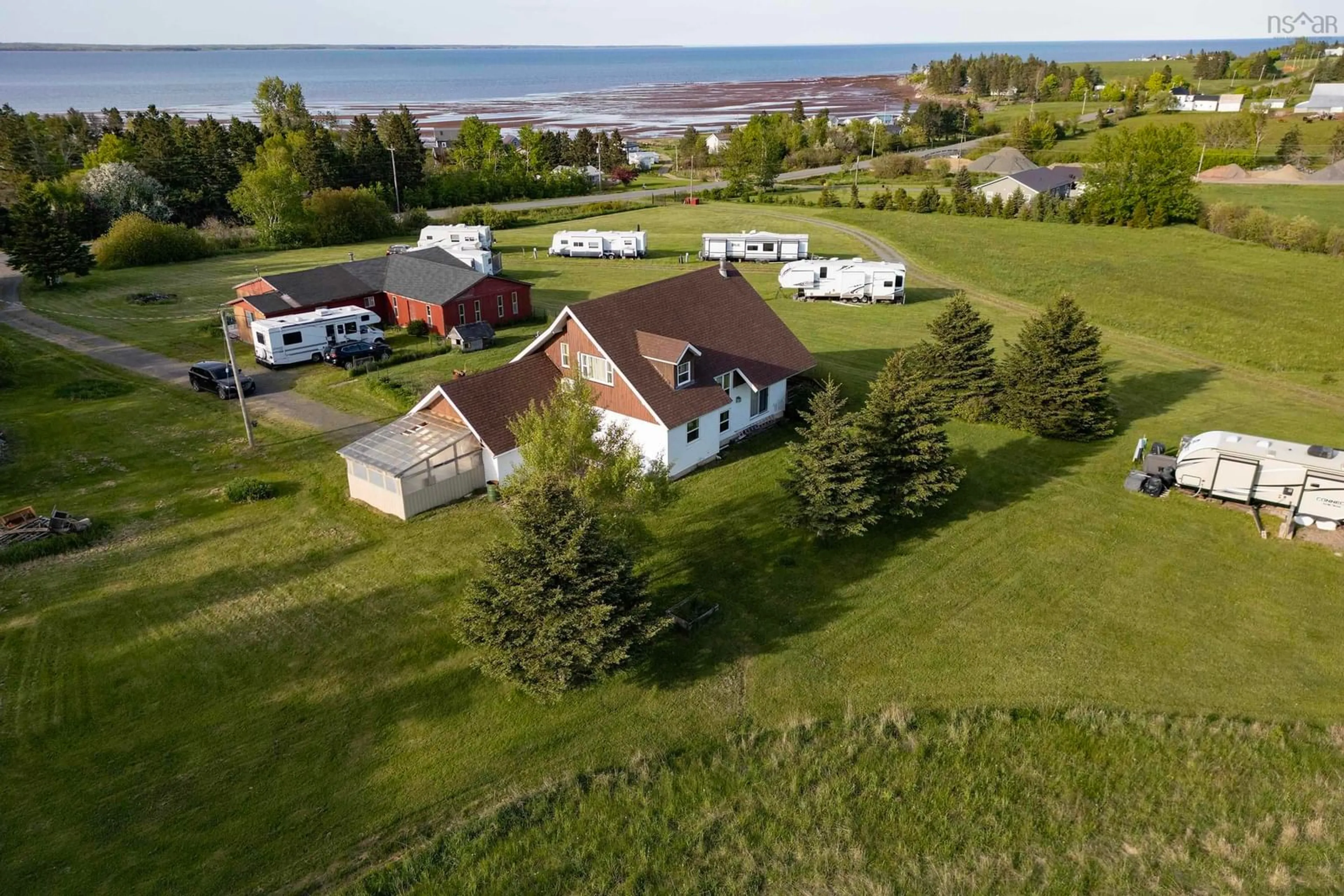 A pic from outside/outdoor area/front of a property/back of a property/a pic from drone, water/lake/river/ocean view for 5096 Highway 366, Lorneville Nova Scotia B4H 3X9