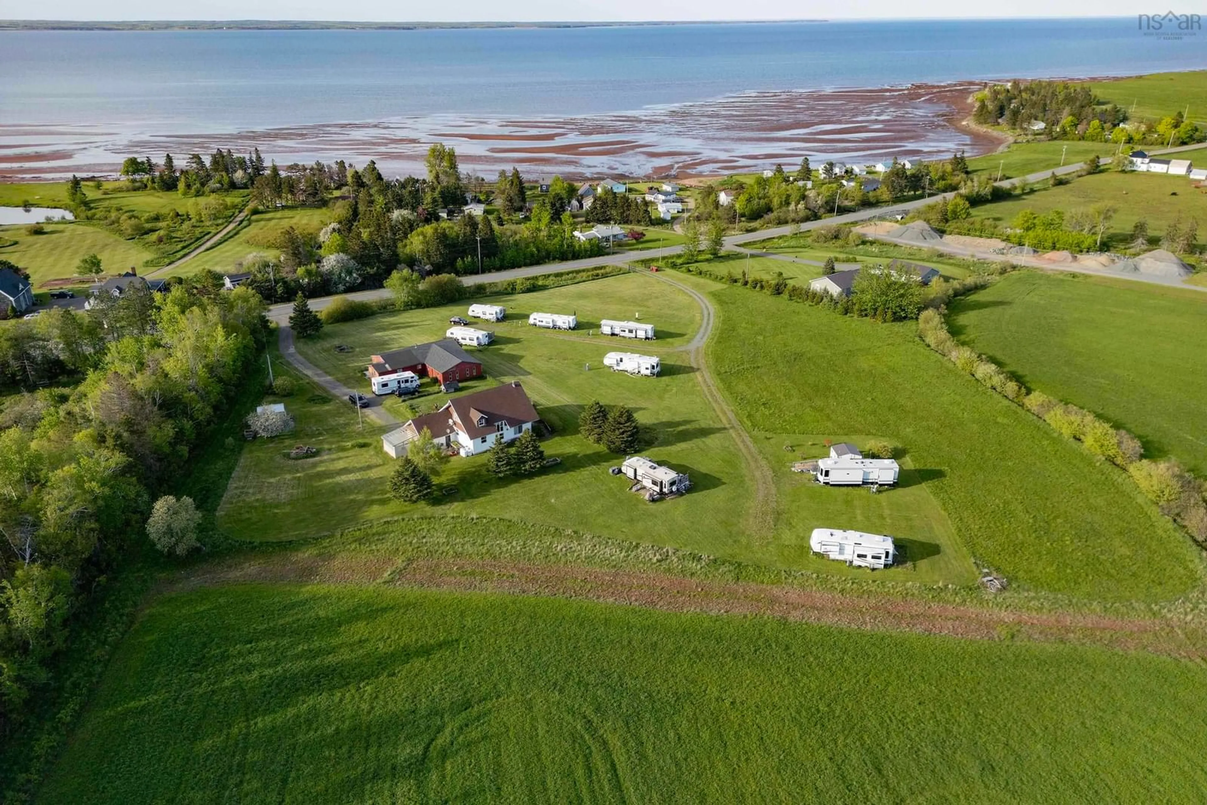 A pic from outside/outdoor area/front of a property/back of a property/a pic from drone, water/lake/river/ocean view for 5096 Highway 366, Lorneville Nova Scotia B4H 3X9