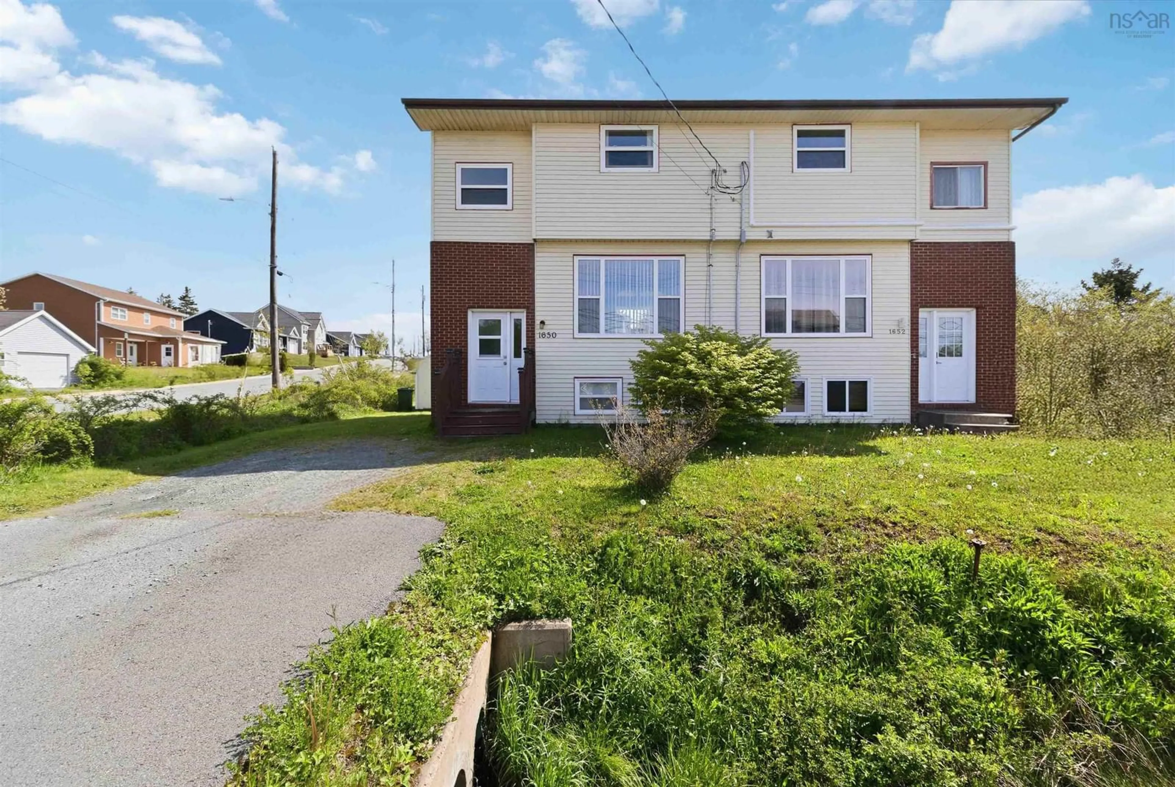 A pic from outside/outdoor area/front of a property/back of a property/a pic from drone, street for 1650 Caldwell Rd, Eastern Passage Nova Scotia B3G 1B1