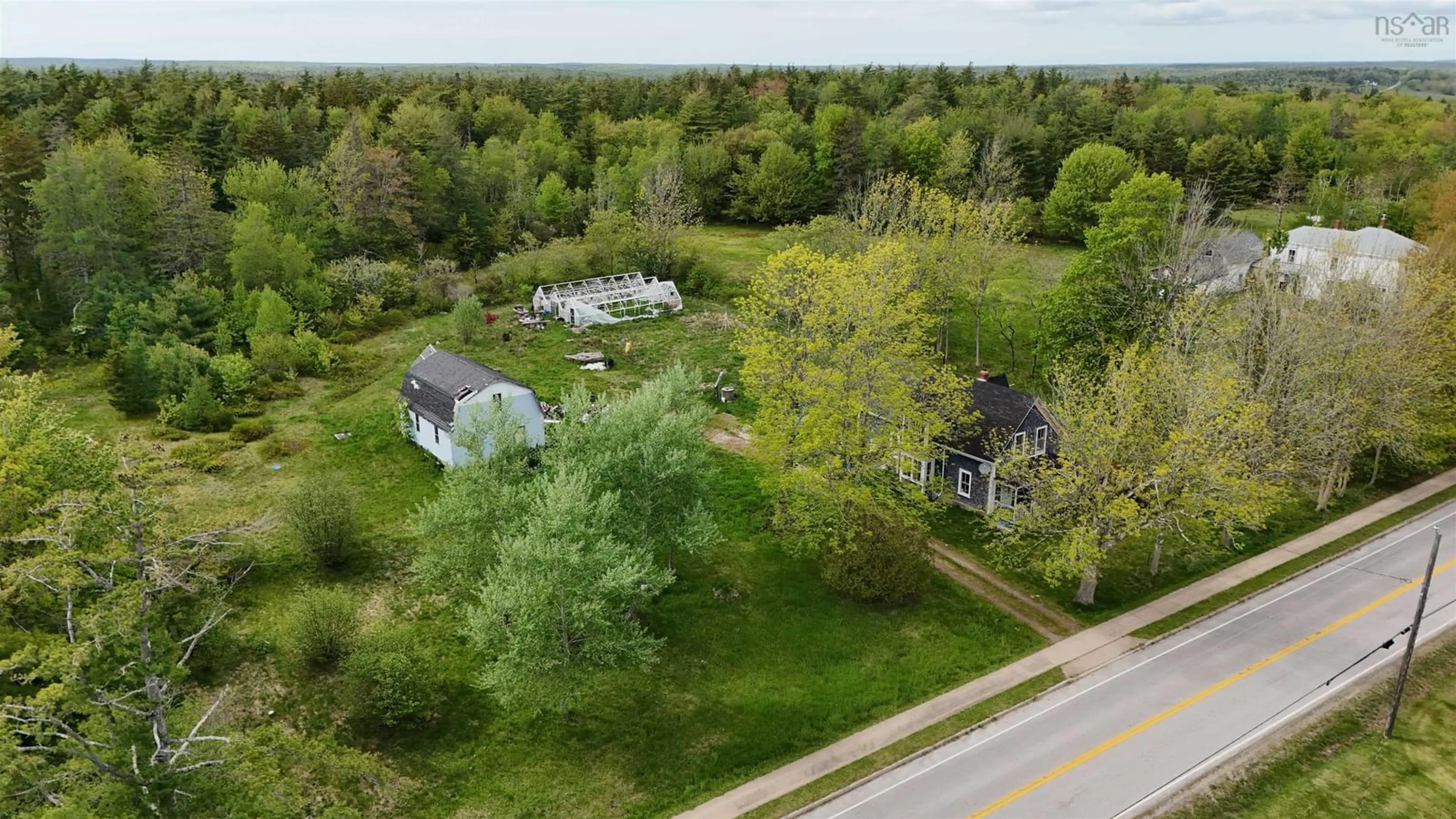 A pic from outside/outdoor area/front of a property/back of a property/a pic from drone, street for 2091 Highway 203, Kemptville Nova Scotia B5A 5P4