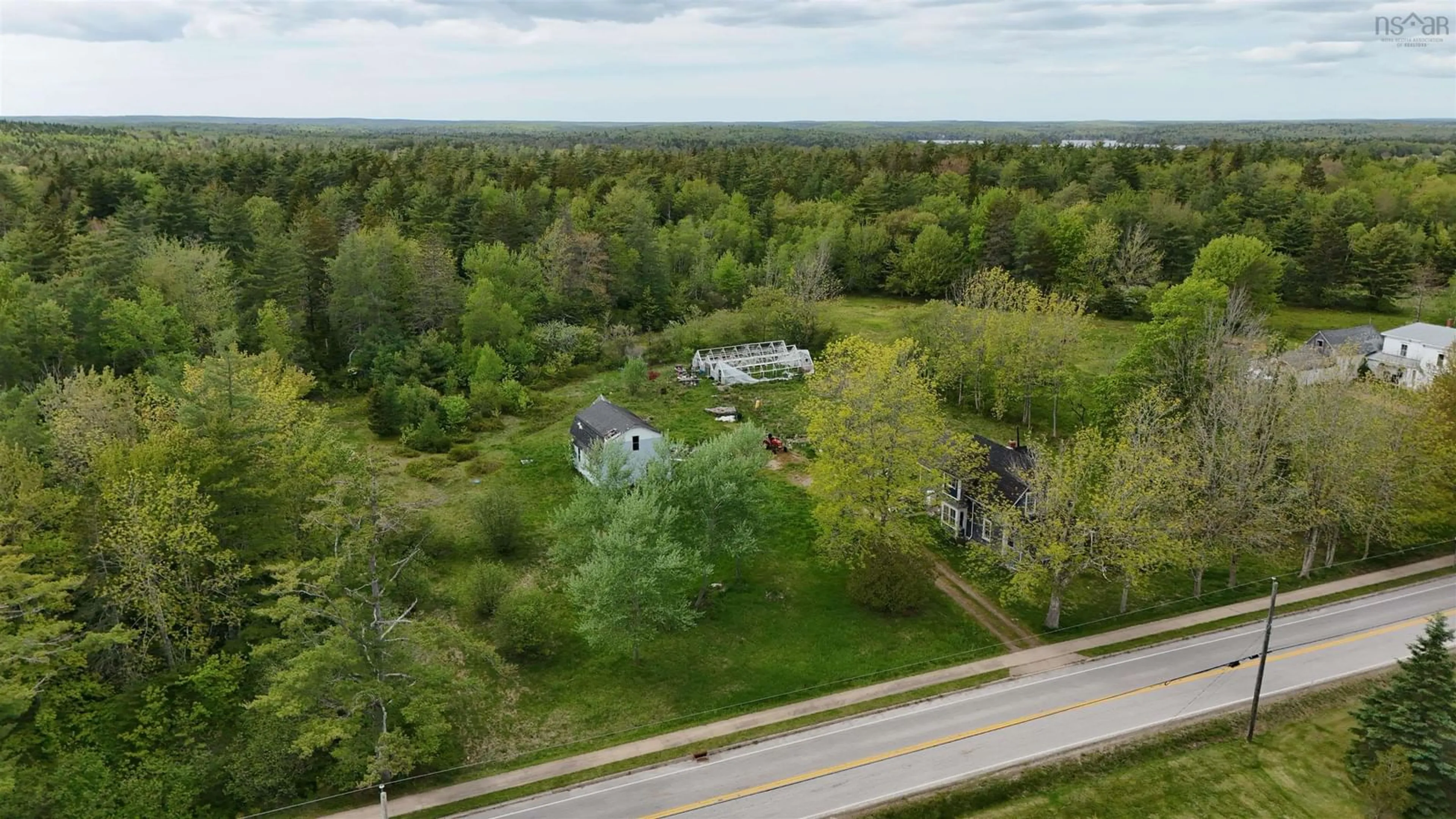A pic from outside/outdoor area/front of a property/back of a property/a pic from drone, unknown for 2091 Highway 203, Kemptville Nova Scotia B5A 5P4