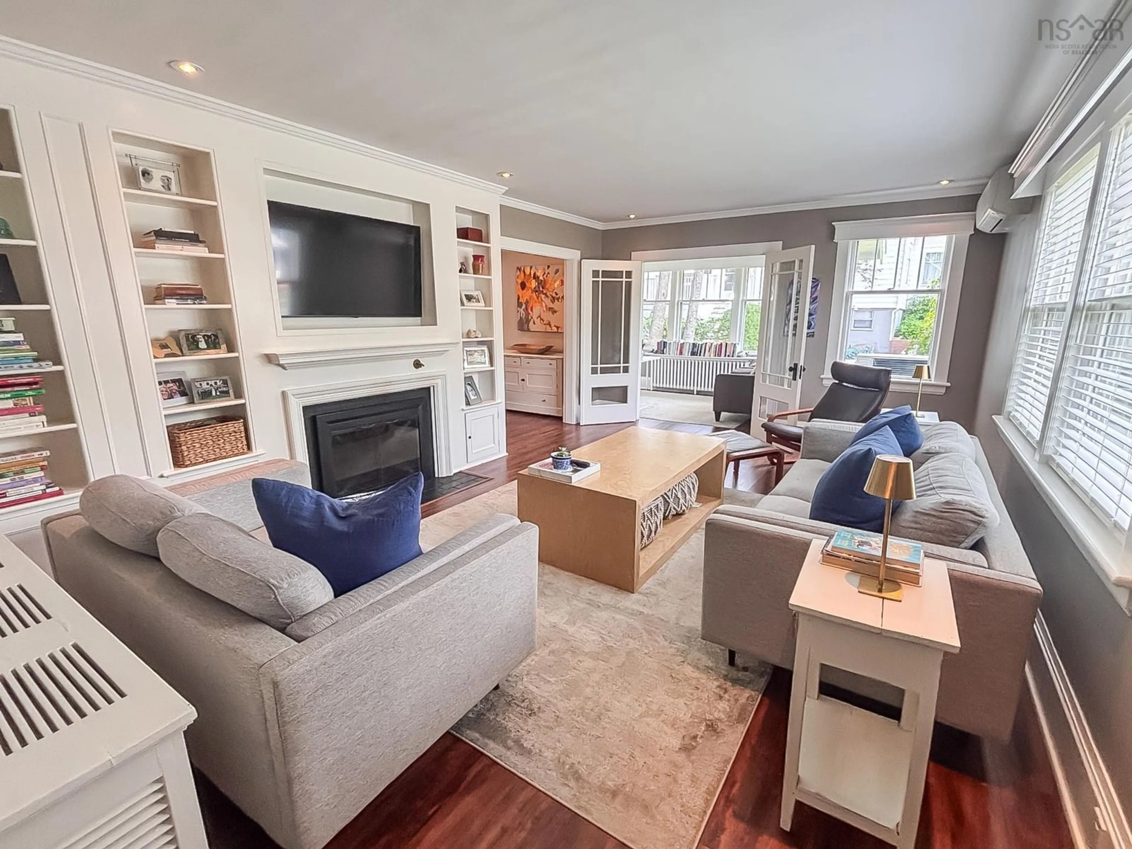 Living room with furniture, wood/laminate floor for 65 Crescent St, Bridgewater Nova Scotia B4V 2C6