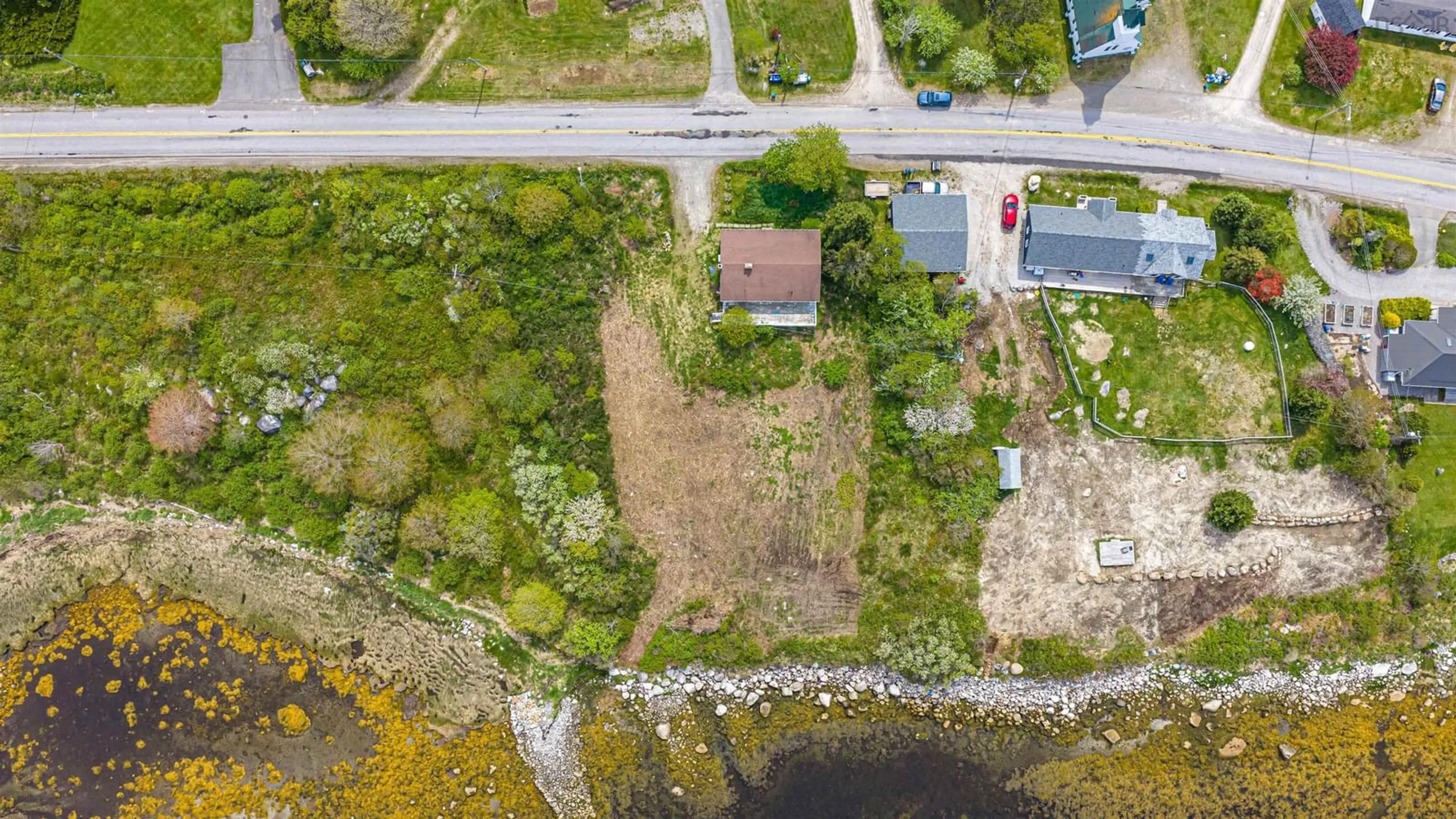 A pic from outside/outdoor area/front of a property/back of a property/a pic from drone, water/lake/river/ocean view for 1166 Sandy Point Rd, Shelburne Nova Scotia B0T 1W0
