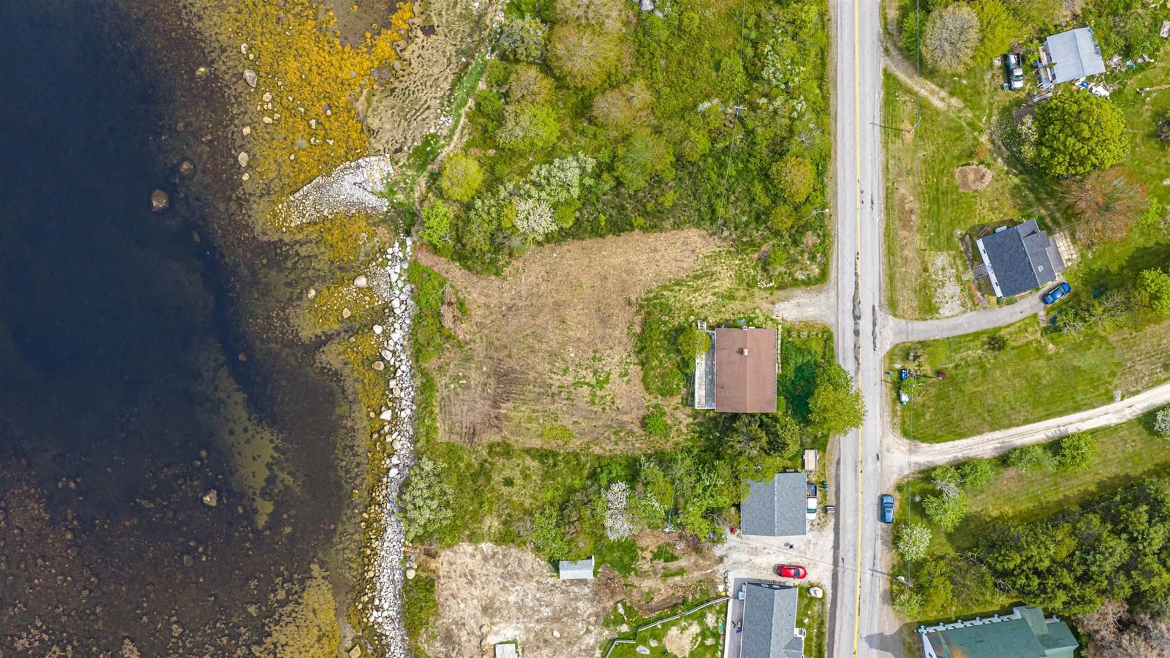 A pic from outside/outdoor area/front of a property/back of a property/a pic from drone, water/lake/river/ocean view for 1166 Sandy Point Rd, Shelburne Nova Scotia B0T 1W0
