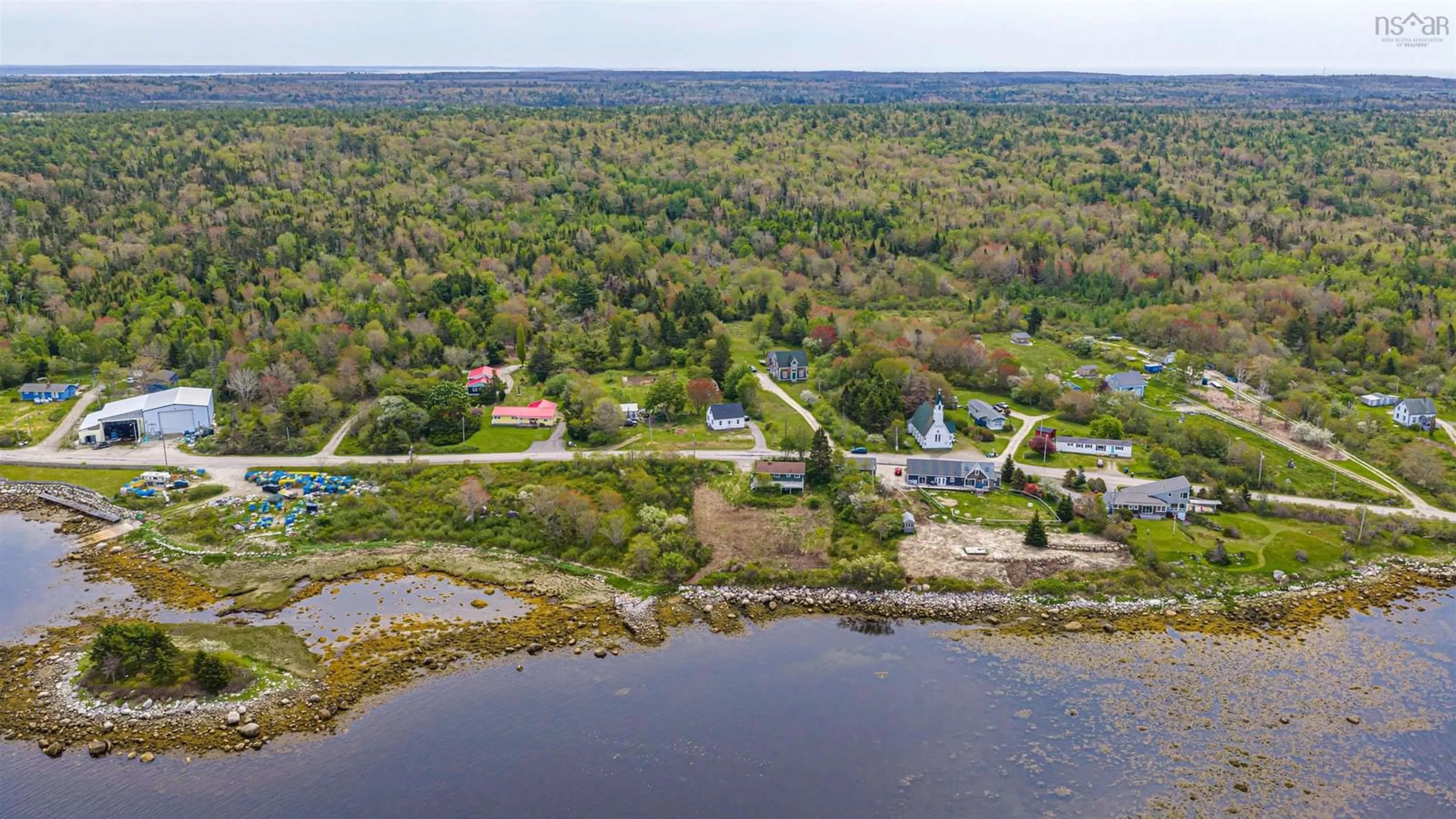 A pic from outside/outdoor area/front of a property/back of a property/a pic from drone, water/lake/river/ocean view for 1166 Sandy Point Rd, Shelburne Nova Scotia B0T 1W0