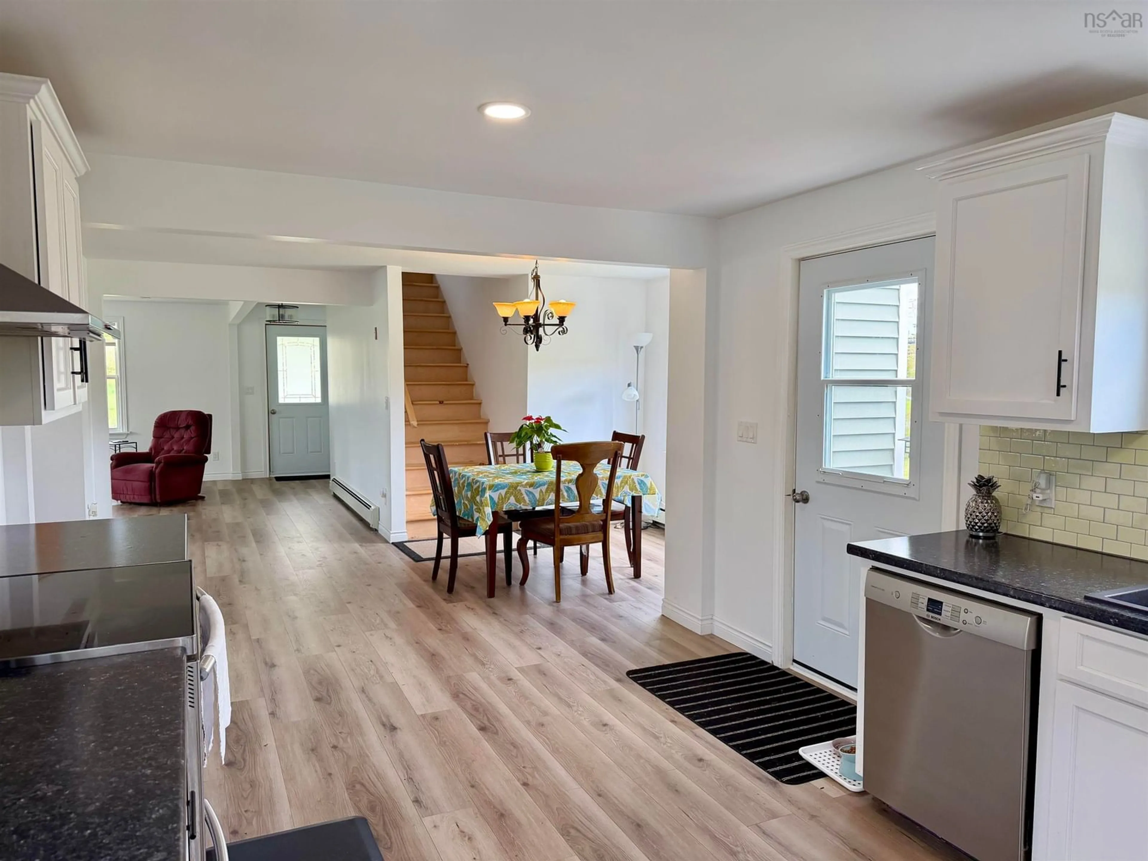 Open concept kitchen, wood/laminate floor for 20 Jacquard Rd, Lower Wedgeport Nova Scotia B0W 2P0
