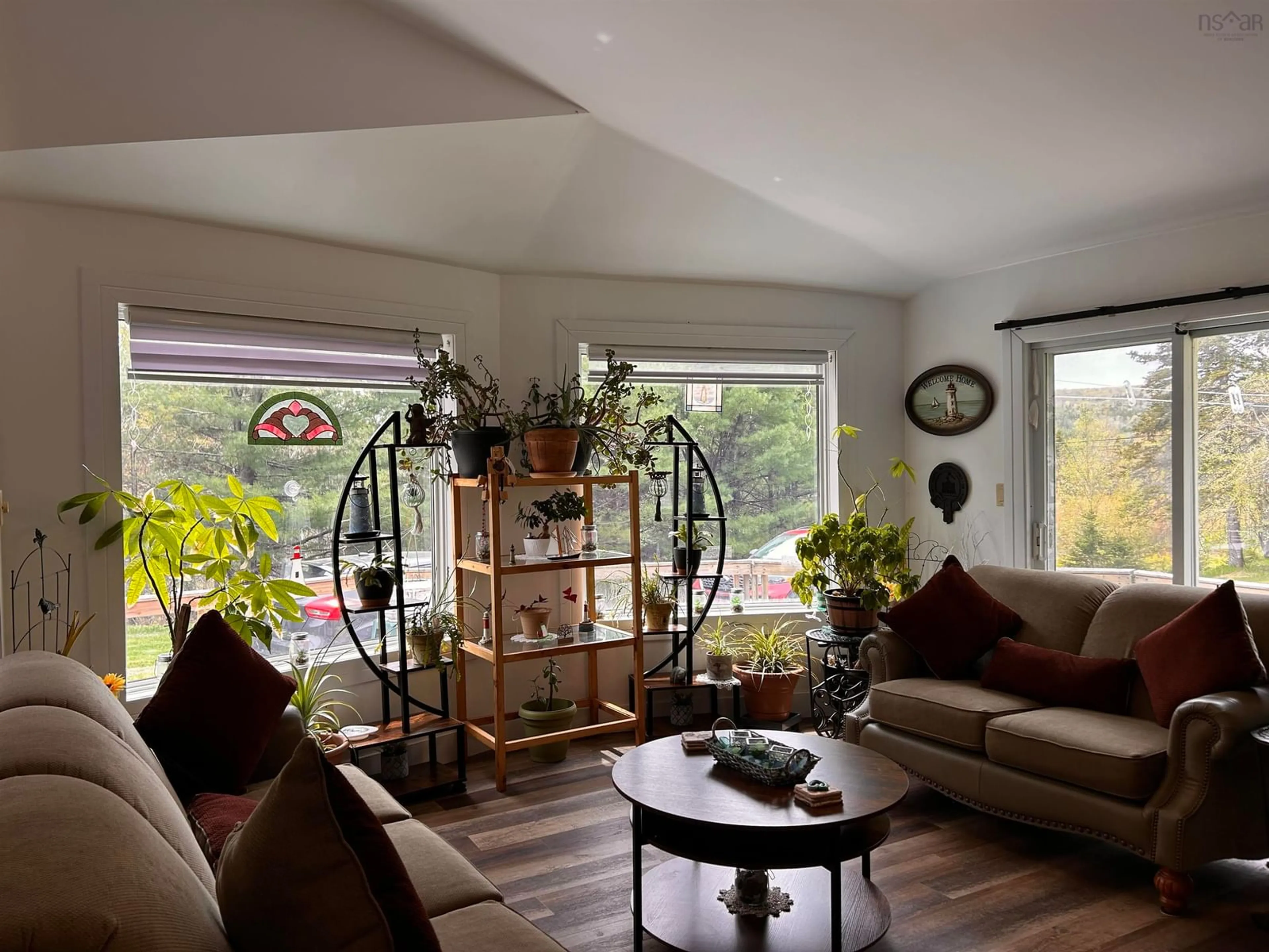 Living room with furniture, wood/laminate floor for 4430 252 Hwy, Hillsboro Nova Scotia B0E 1X0
