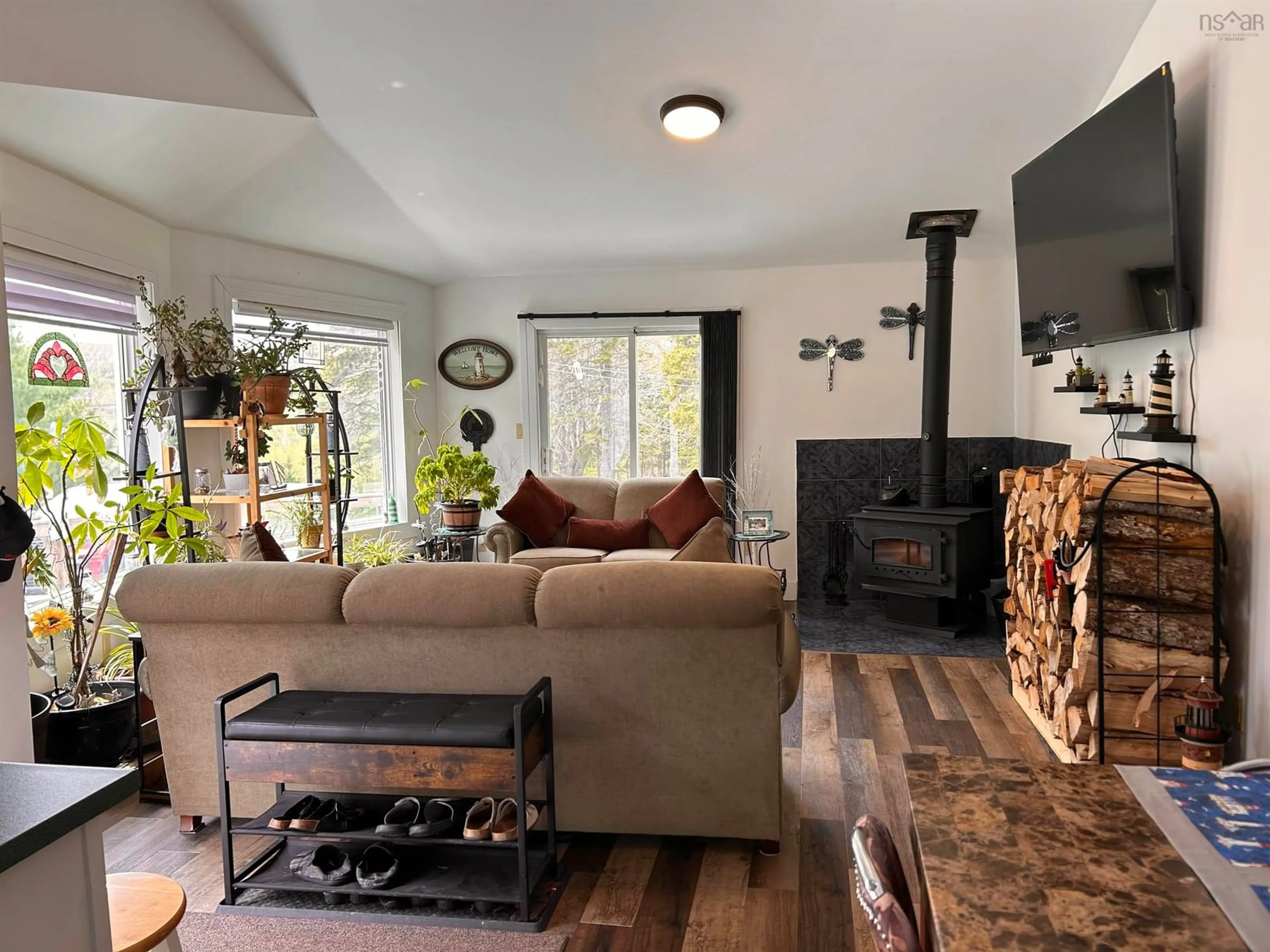 Living room with furniture, wood/laminate floor for 4430 252 Hwy, Hillsboro Nova Scotia B0E 1X0