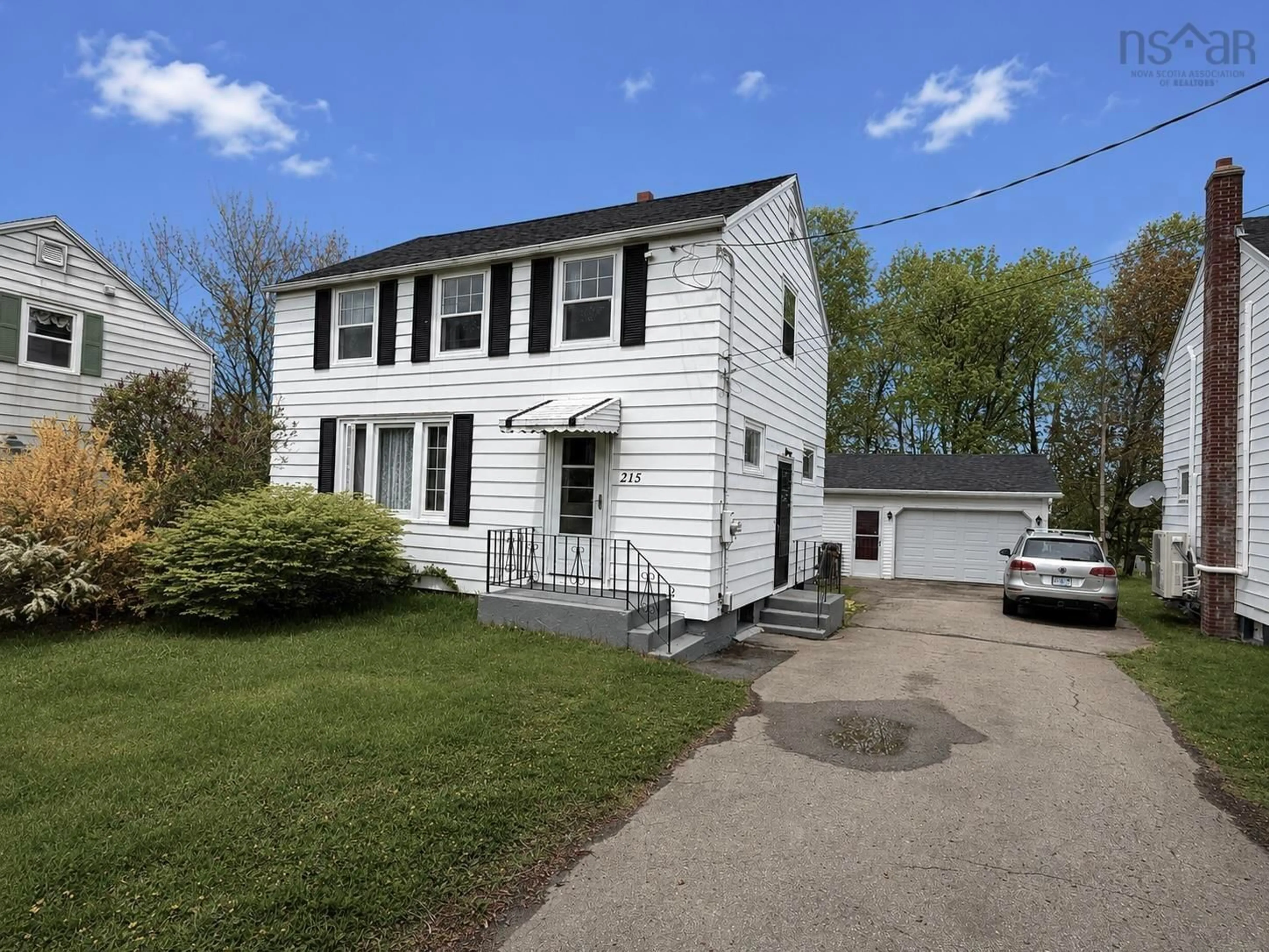 Home with vinyl exterior material, street for 215 Cottage Rd, Sydney Nova Scotia B1P 2E7