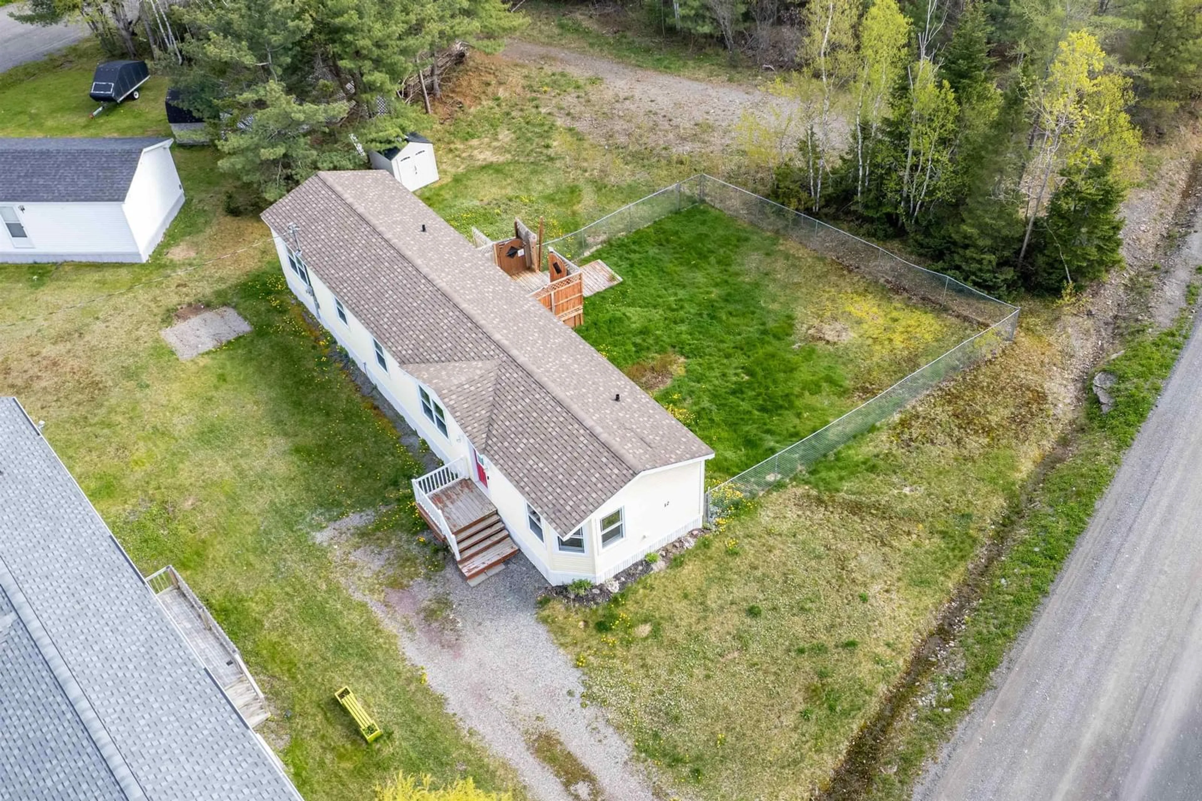 A pic from outside/outdoor area/front of a property/back of a property/a pic from drone, unknown for 12 Whispering Pines Rd, Mira Road Nova Scotia B1M 1C6
