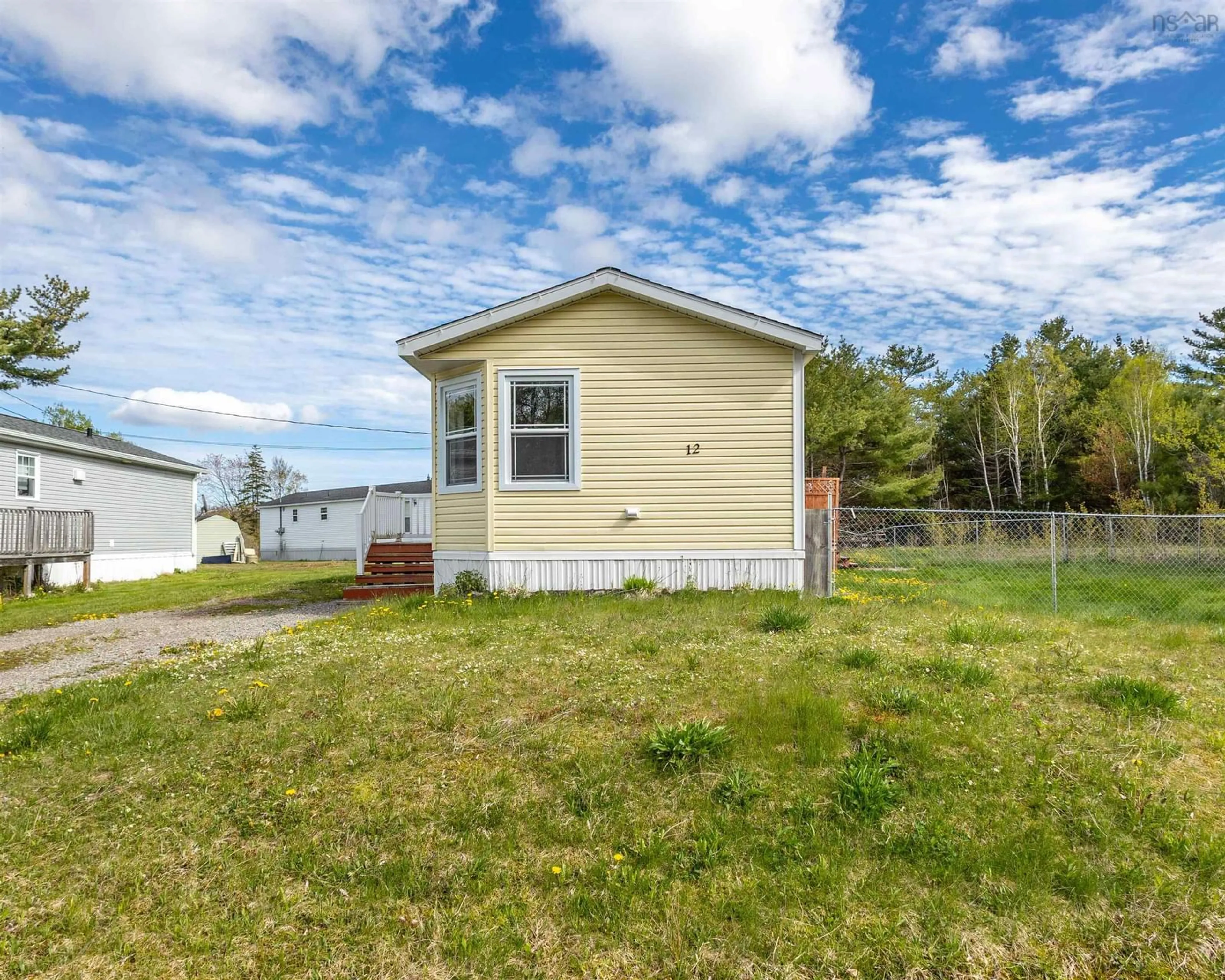 Home with vinyl exterior material, street for 12 Whispering Pines Rd, Mira Road Nova Scotia B1M 1C6