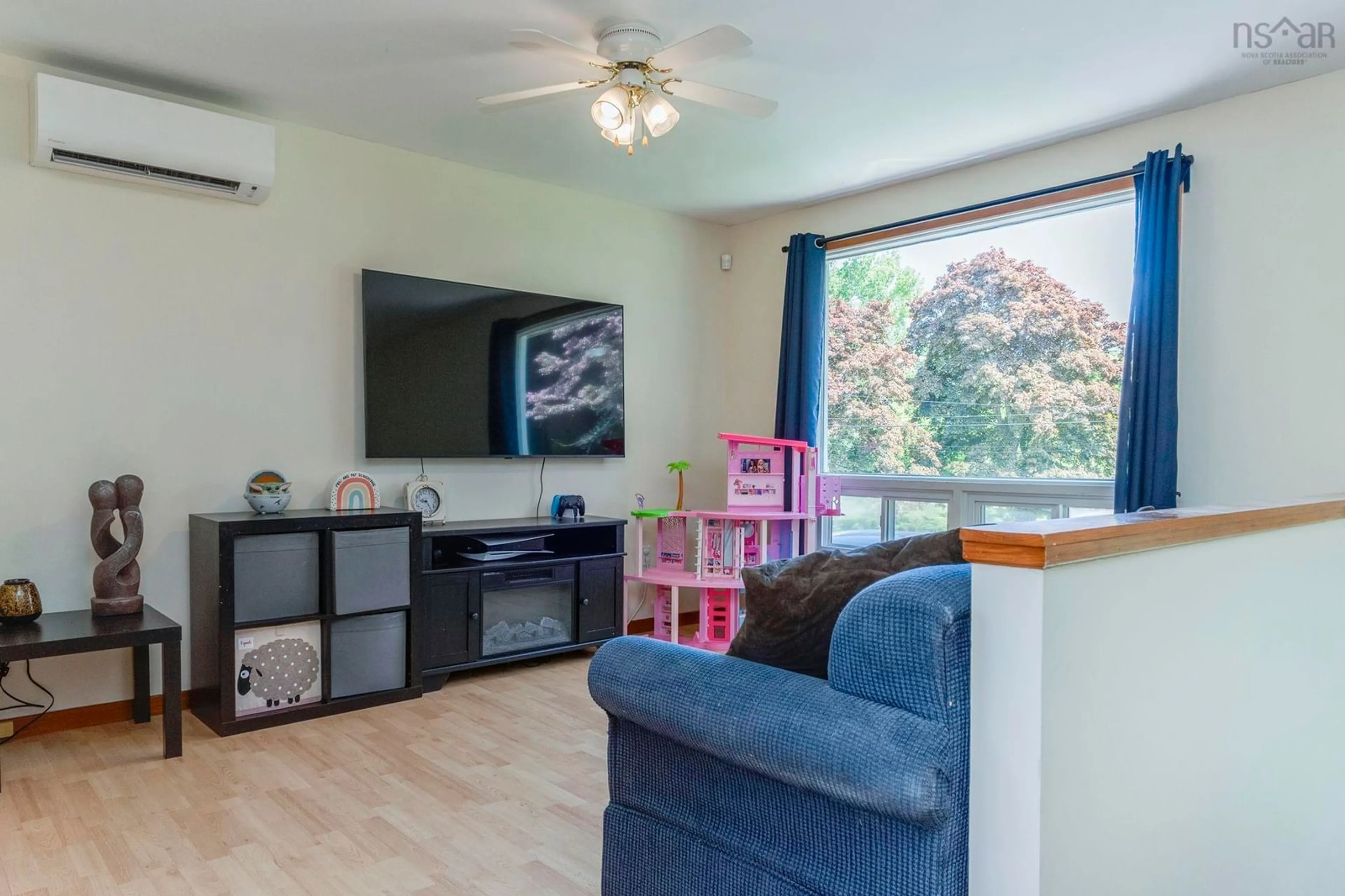 Living room with furniture, wood/laminate floor for 4 Reagh Avenue Ave, Middleton Nova Scotia B0S 1P0