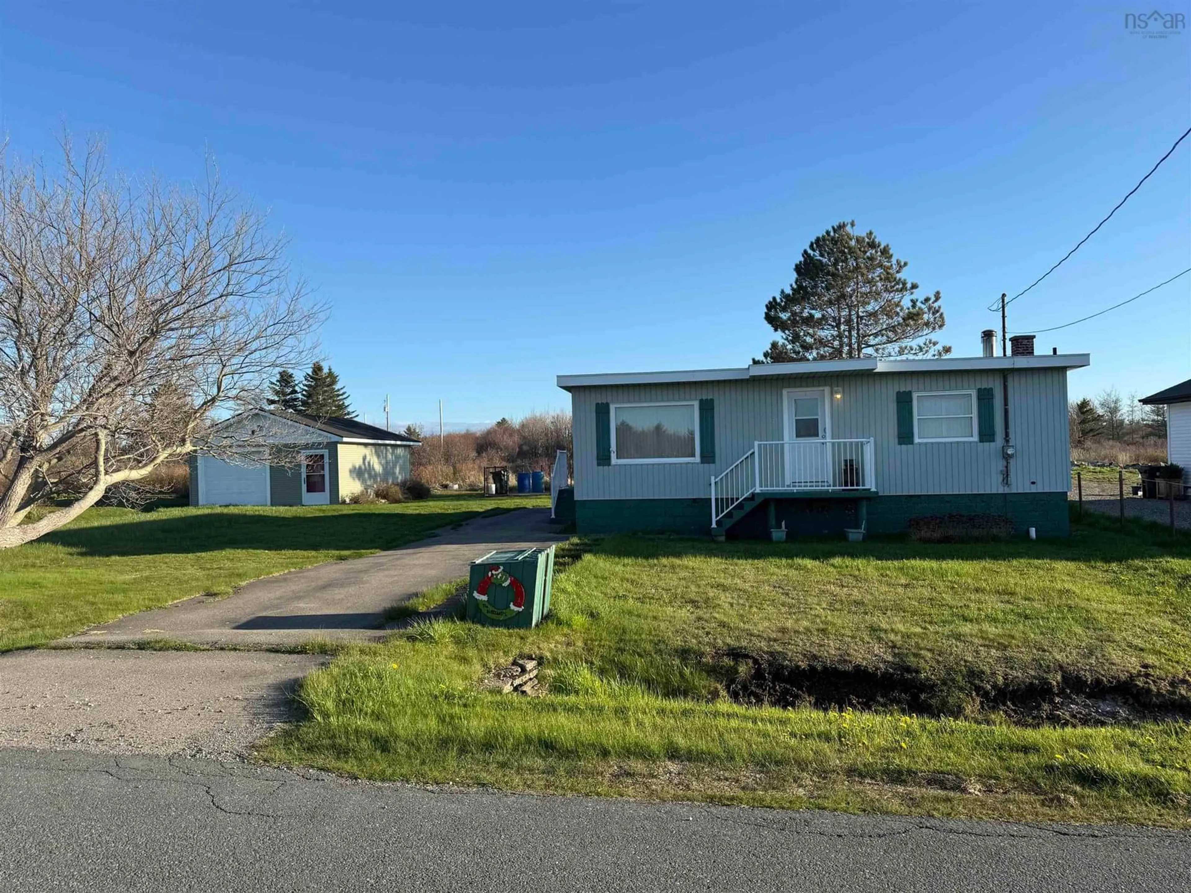 A pic from outside/outdoor area/front of a property/back of a property/a pic from drone, street for 40 Daley Rd, New Victoria Nova Scotia B1H 4Z4