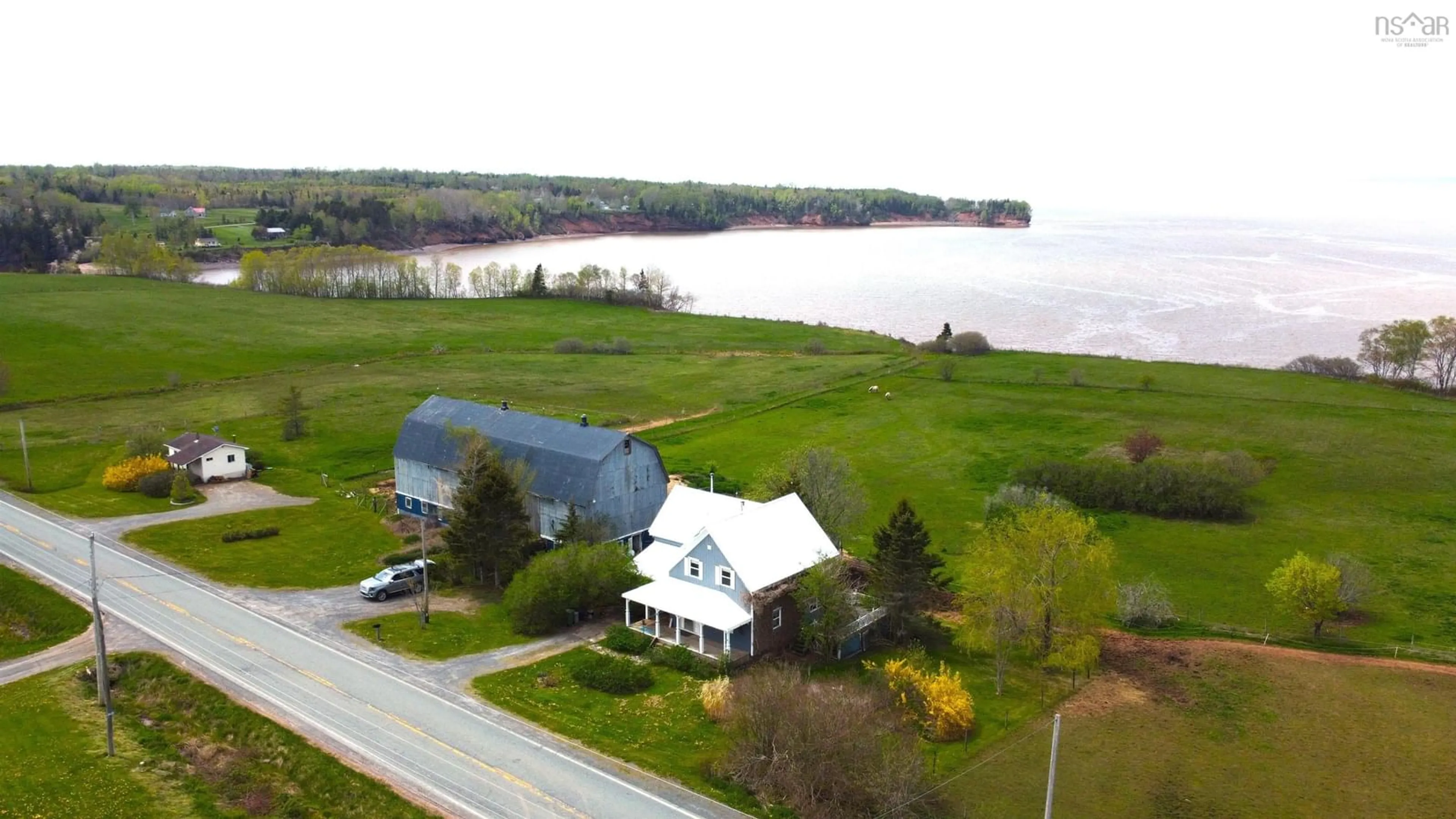 A pic from outside/outdoor area/front of a property/back of a property/a pic from drone, water/lake/river/ocean view for 2621 215 Hwy, Tennecape Nova Scotia B0N 2R0
