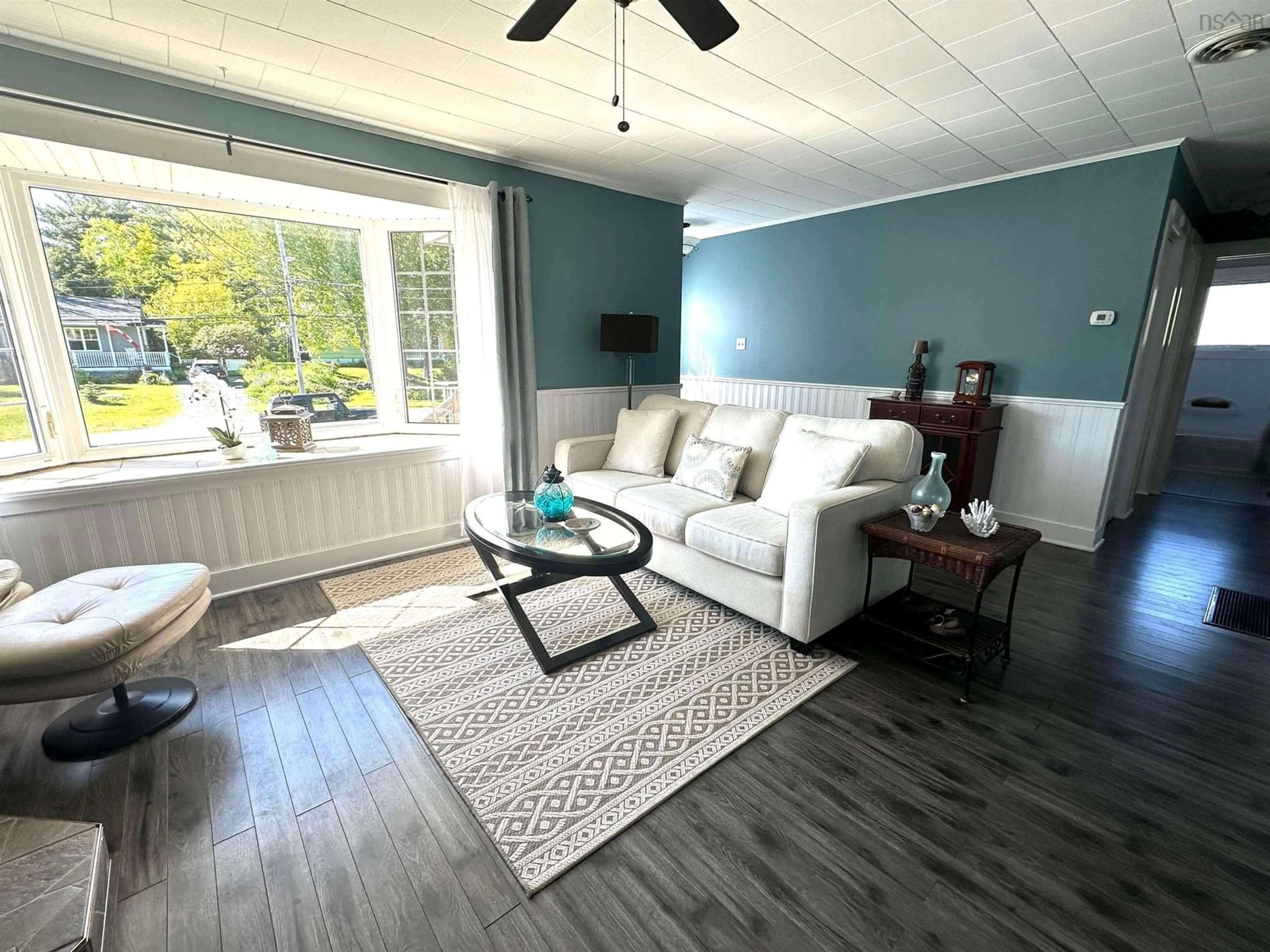 Living room with furniture, wood/laminate floor for 39 Barss St, Liverpool Nova Scotia B0T 1K0
