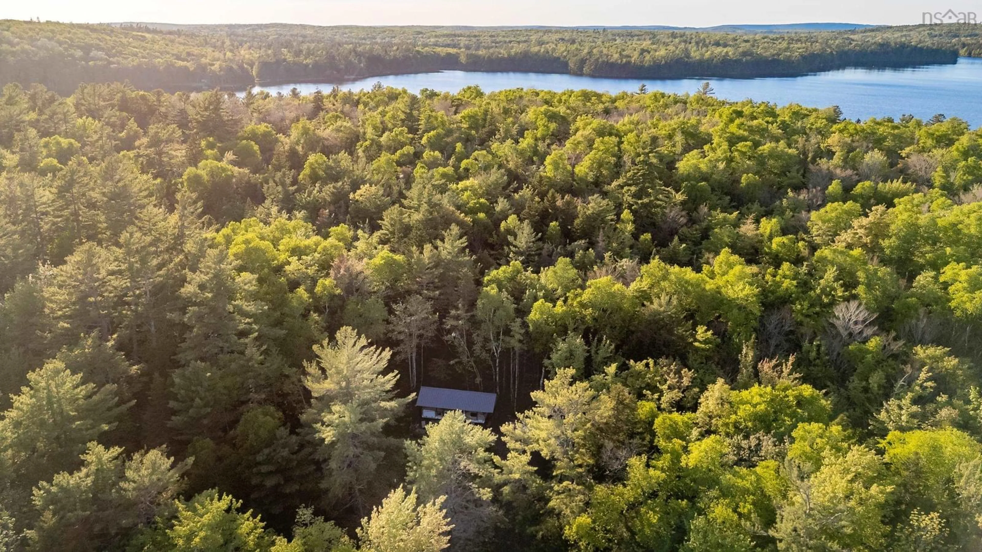 A pic from outside/outdoor area/front of a property/back of a property/a pic from drone, forest/trees view for 535 Grand Lake Rd, Virginia East Nova Scotia B0S 0A6