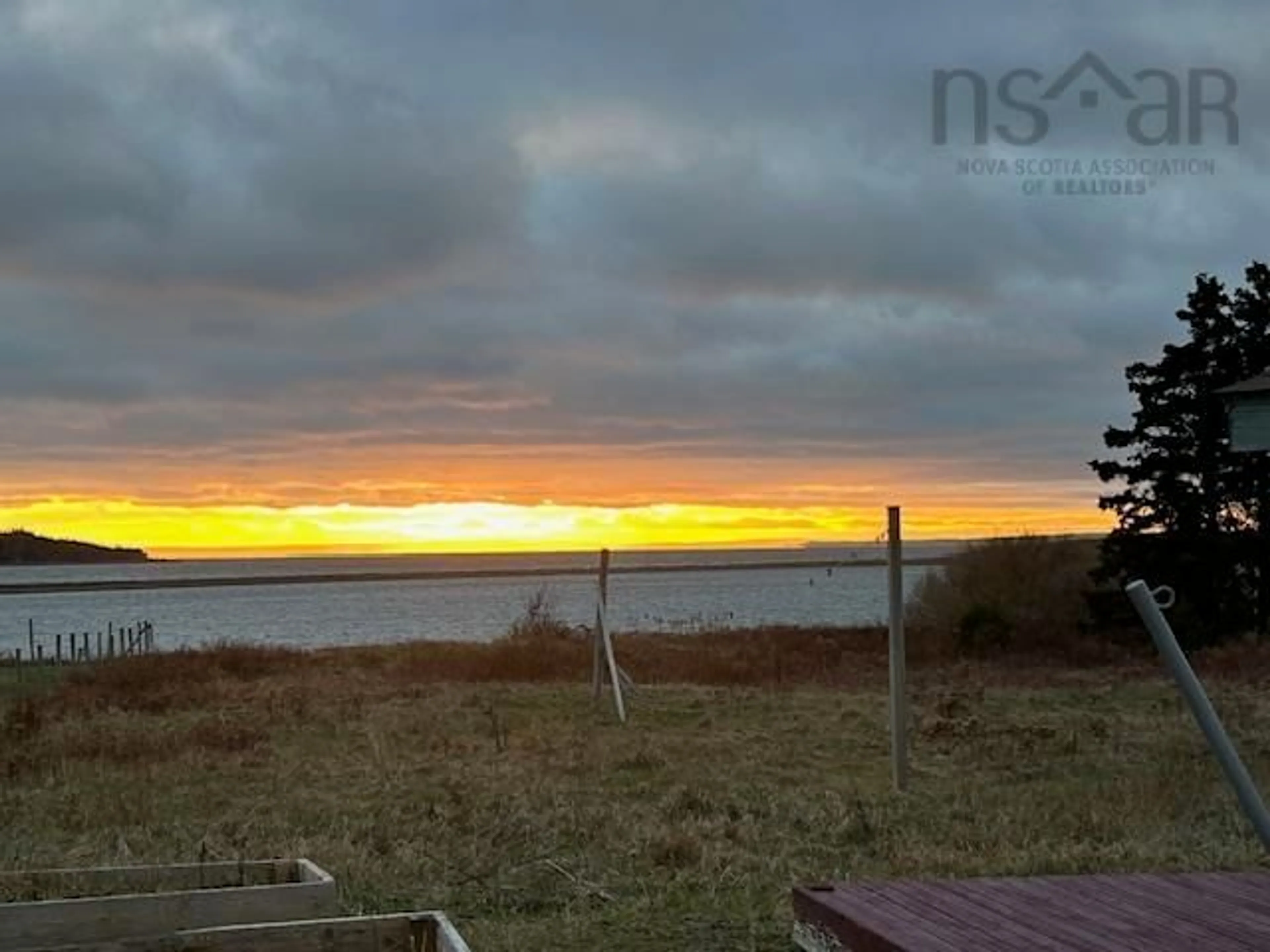 A pic from outside/outdoor area/front of a property/back of a property/a pic from drone, water/lake/river/ocean view for 19 Cove Rd, West Arichat Nova Scotia B0E 3J0