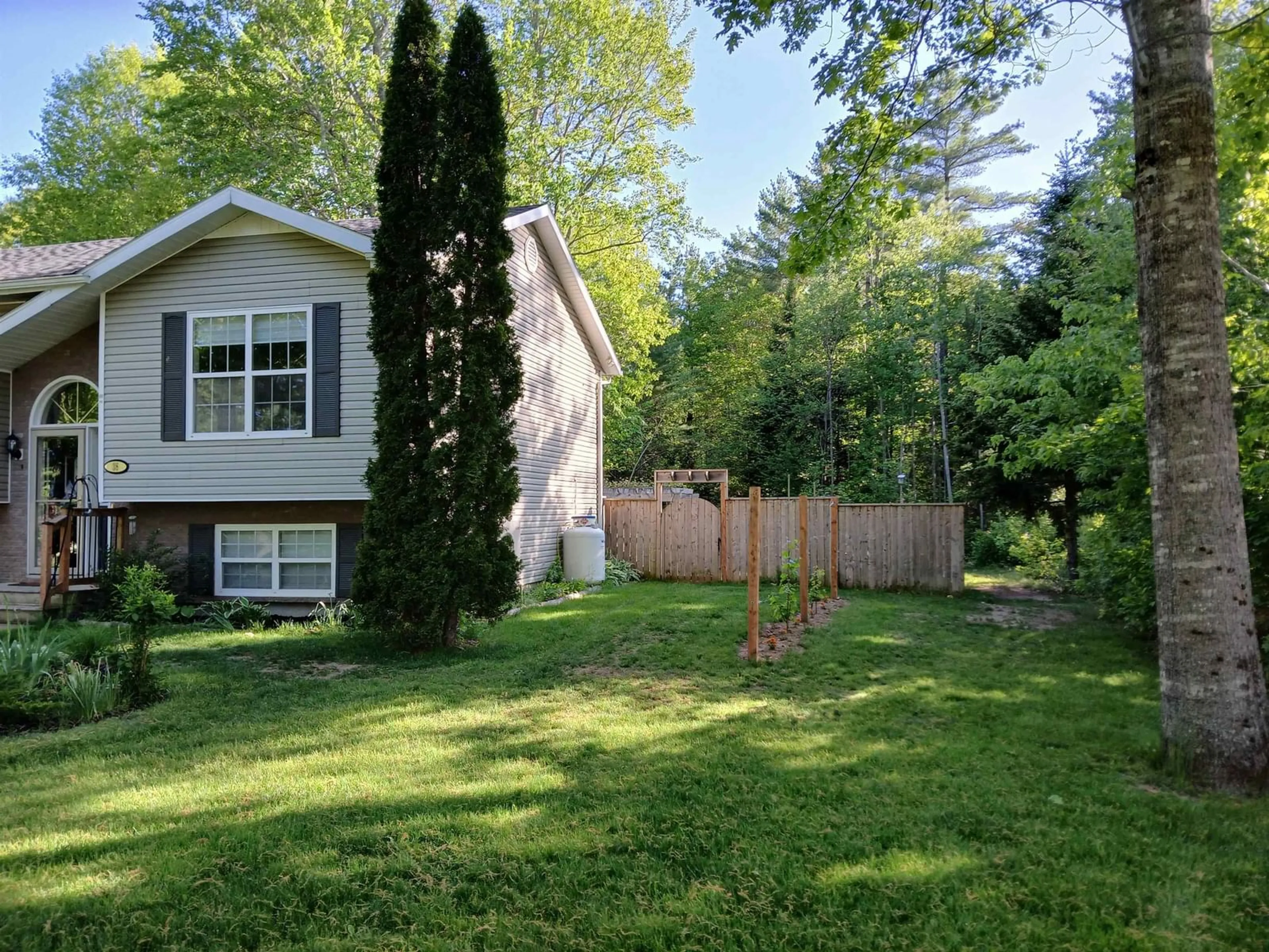 A pic from outside/outdoor area/front of a property/back of a property/a pic from drone, forest/trees view for 38 Robie Ave, Greenwood Nova Scotia B0P 1R0
