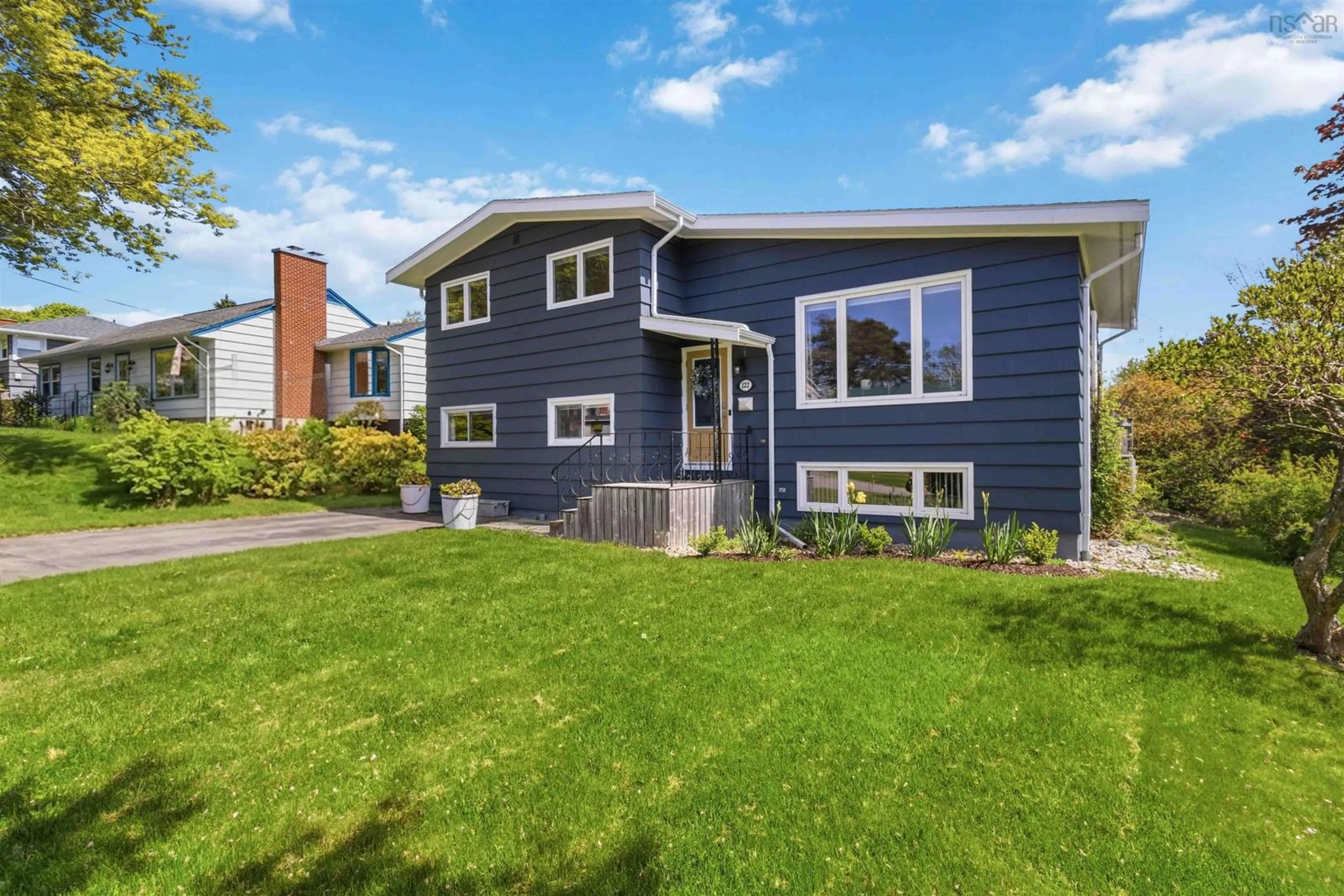Home with vinyl exterior material, street for 122 Brook St, Lunenburg Nova Scotia B0J 2C0