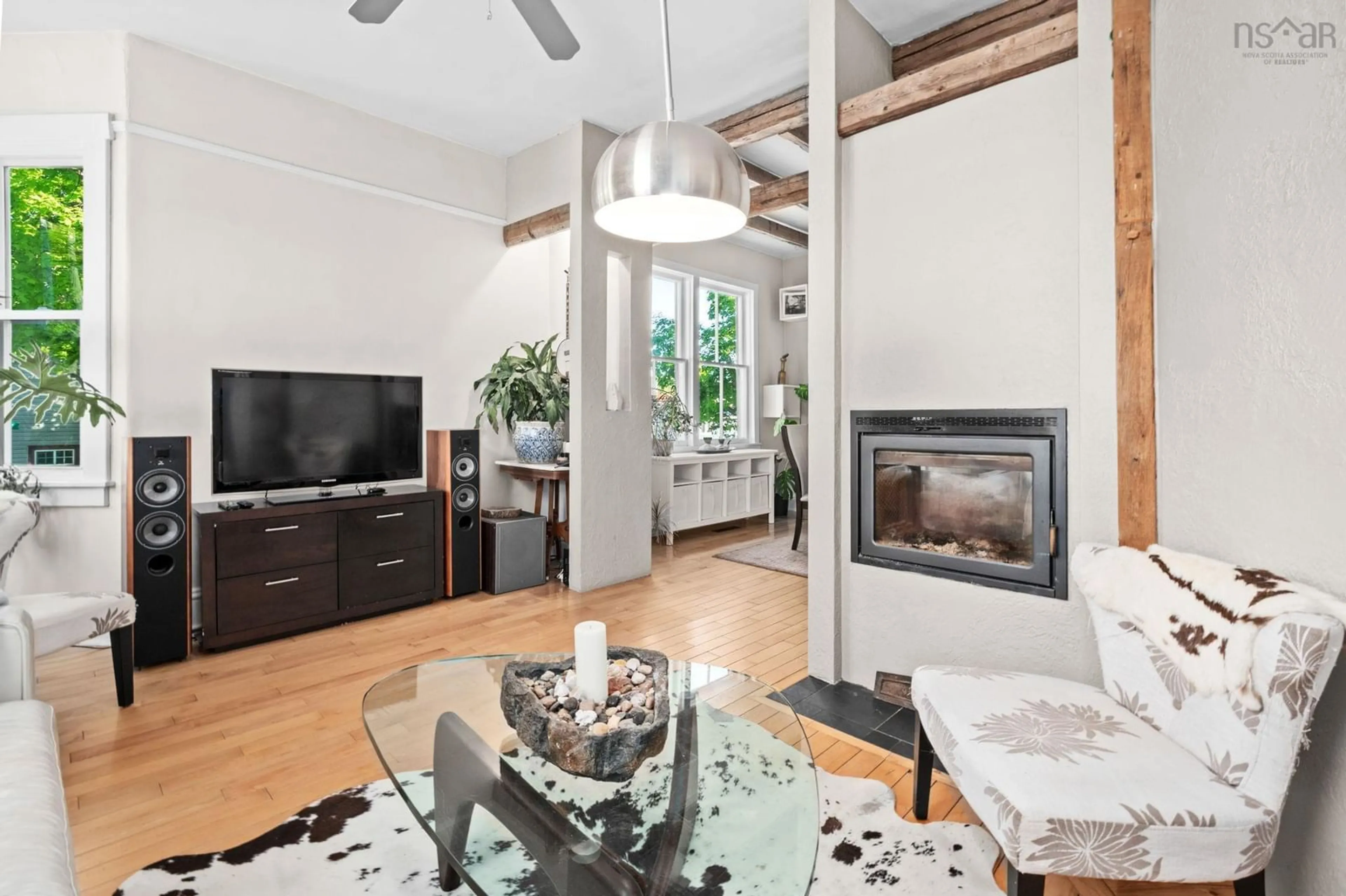 Living room with furniture, wood/laminate floor for 3342 Robie St, Halifax Nova Scotia B3K 4S2