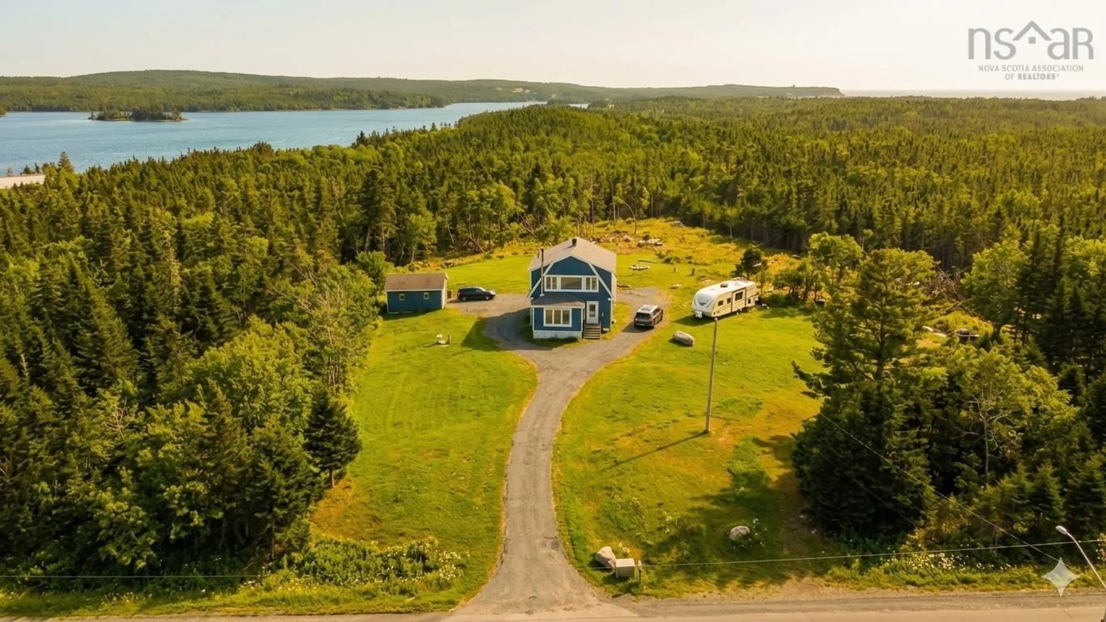 A pic from outside/outdoor area/front of a property/back of a property/a pic from drone, water/lake/river/ocean view for 2351 Ostrea Lake Rd, Ostrea Lake Nova Scotia B0J 2L0