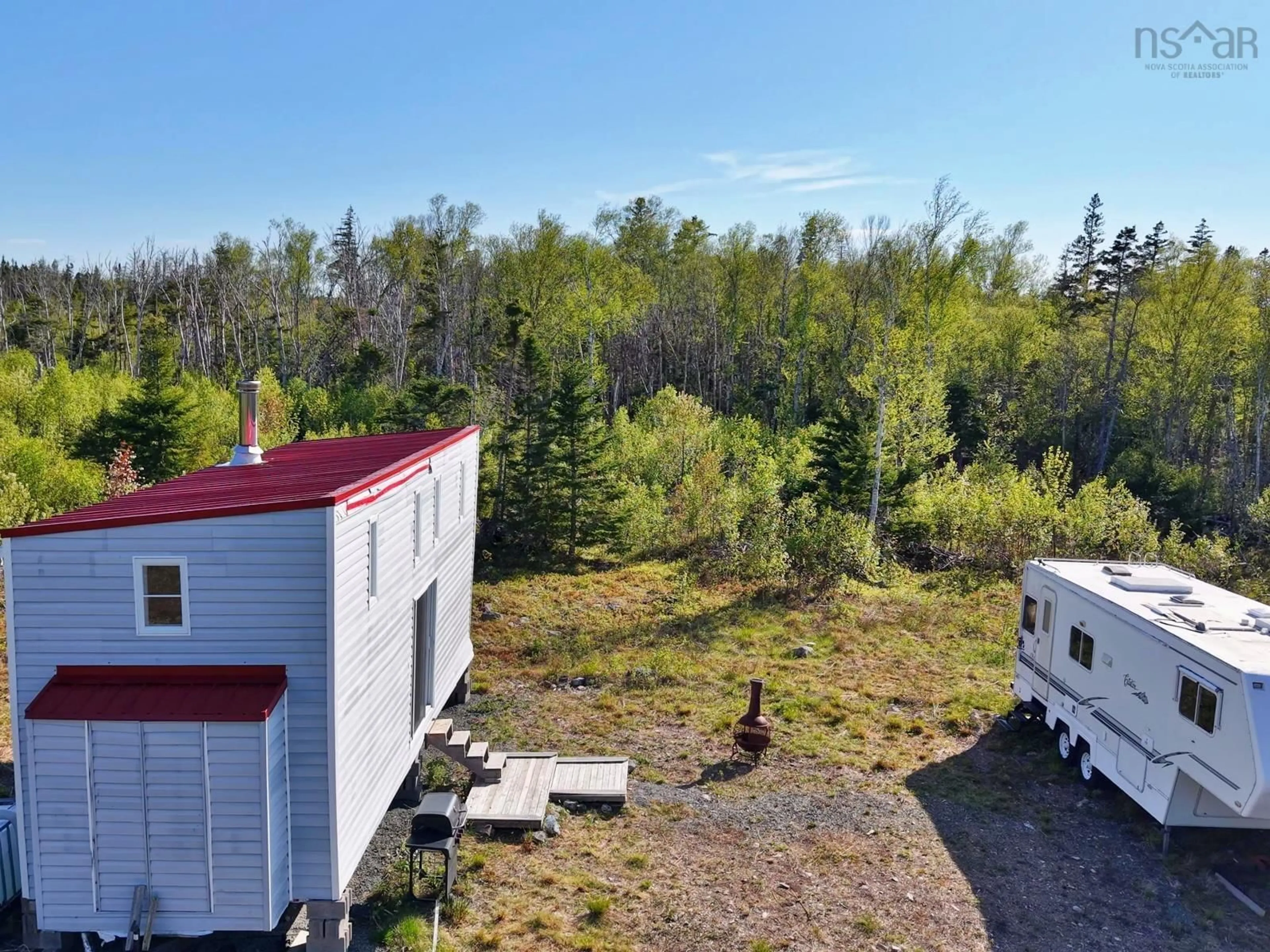 A pic from outside/outdoor area/front of a property/back of a property/a pic from drone, forest/trees view for 9054 East Bay Hwy, Middle Cape Nova Scotia B1J 2A4