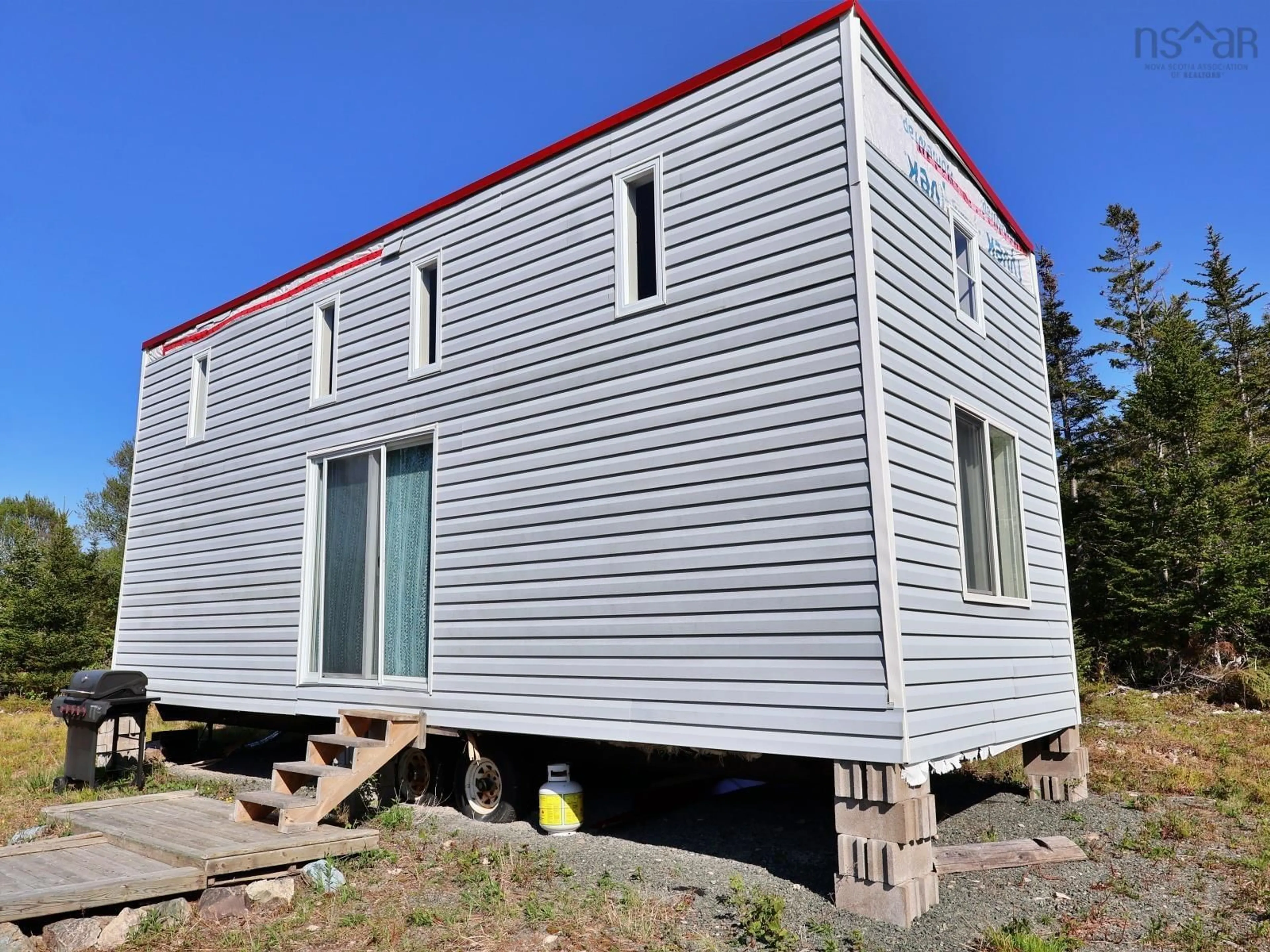 Home with vinyl exterior material, building for 9054 East Bay Hwy, Middle Cape Nova Scotia B1J 2A4