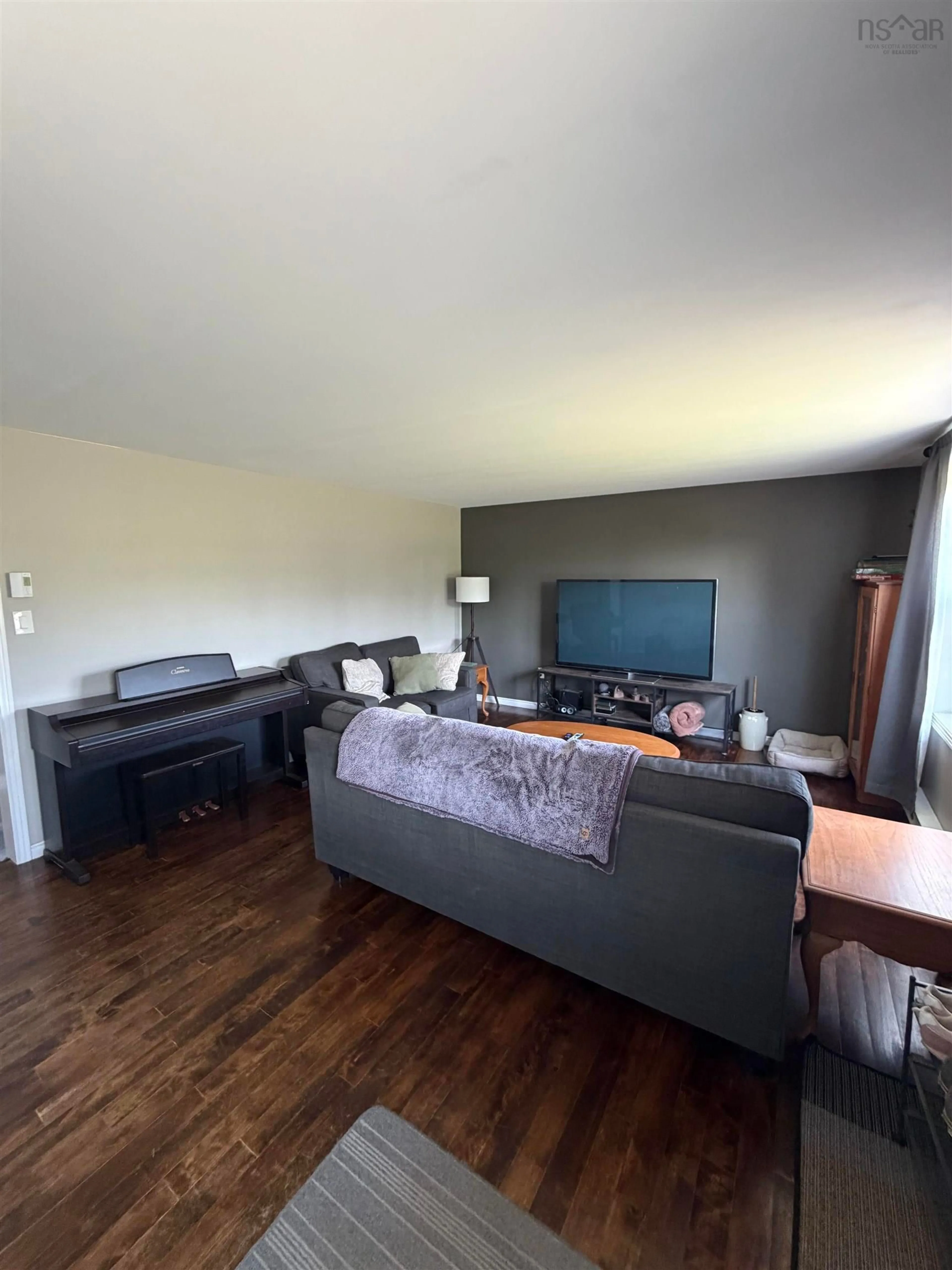 Living room with furniture, wood/laminate floor for 4081 South River Road, Antigonish Nova Scotia B2G 0B4